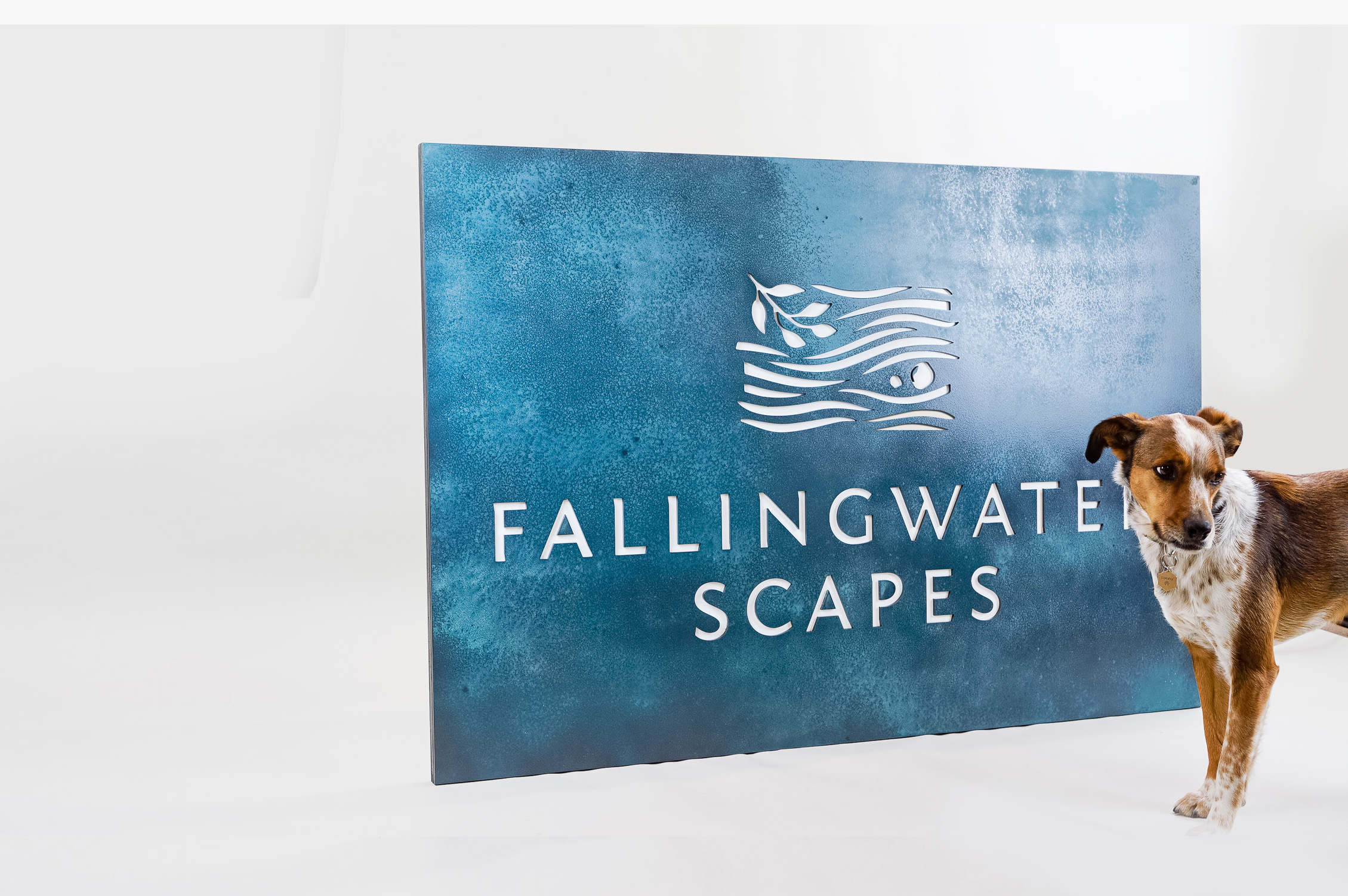 Blue-hued, rusted bronze/brass/copper patina style sign for FallingWater Scapes, a water feature design, construction and maintenance company in Dover, MA. Blue-hued, rusted bronze/brass/copper patina style sign for FallingWater Scapes, a water feature design, construction and maintenance company in Dover, MA.