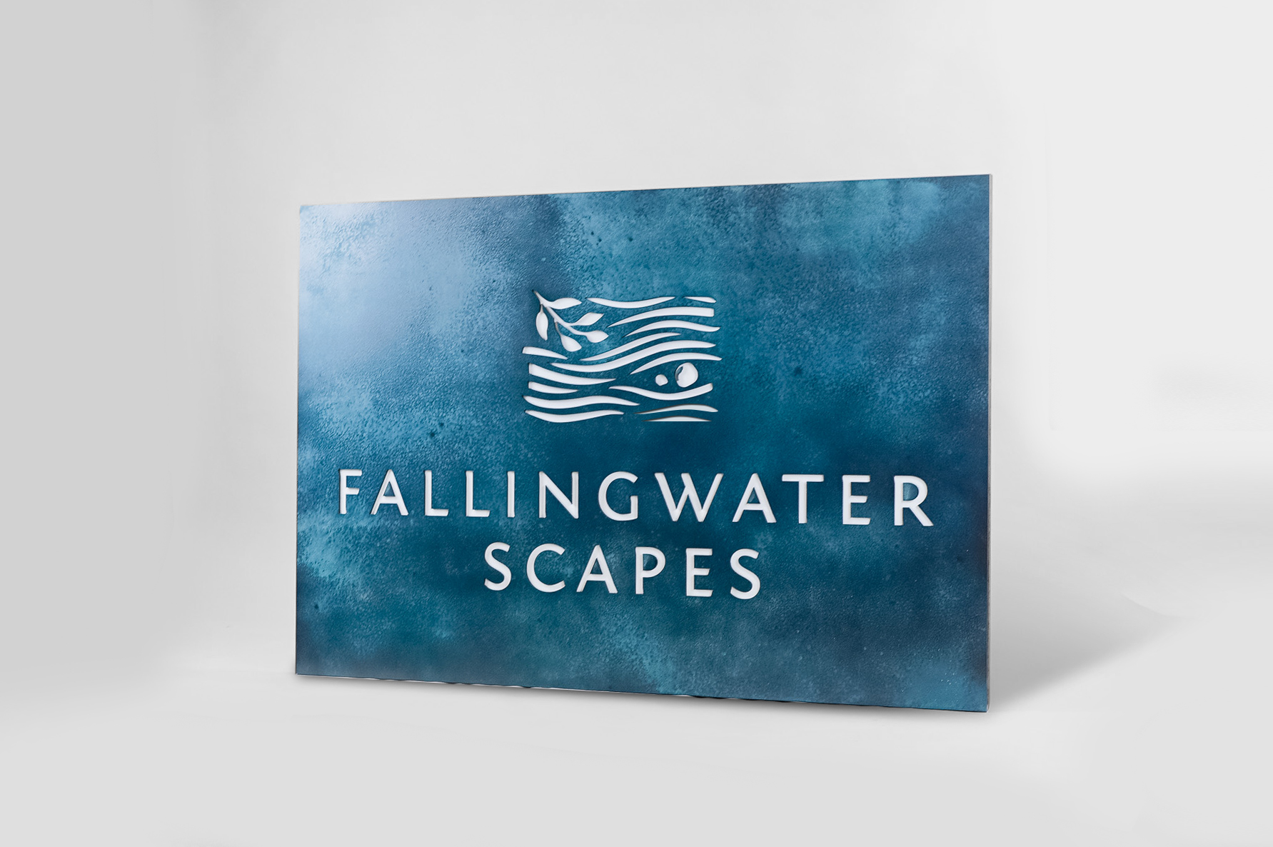 Blue-hued, rusted bronze/brass/copper patina style sign for FallingWater Scapes, a water feature design, construction and maintenance company in Dover, MA.