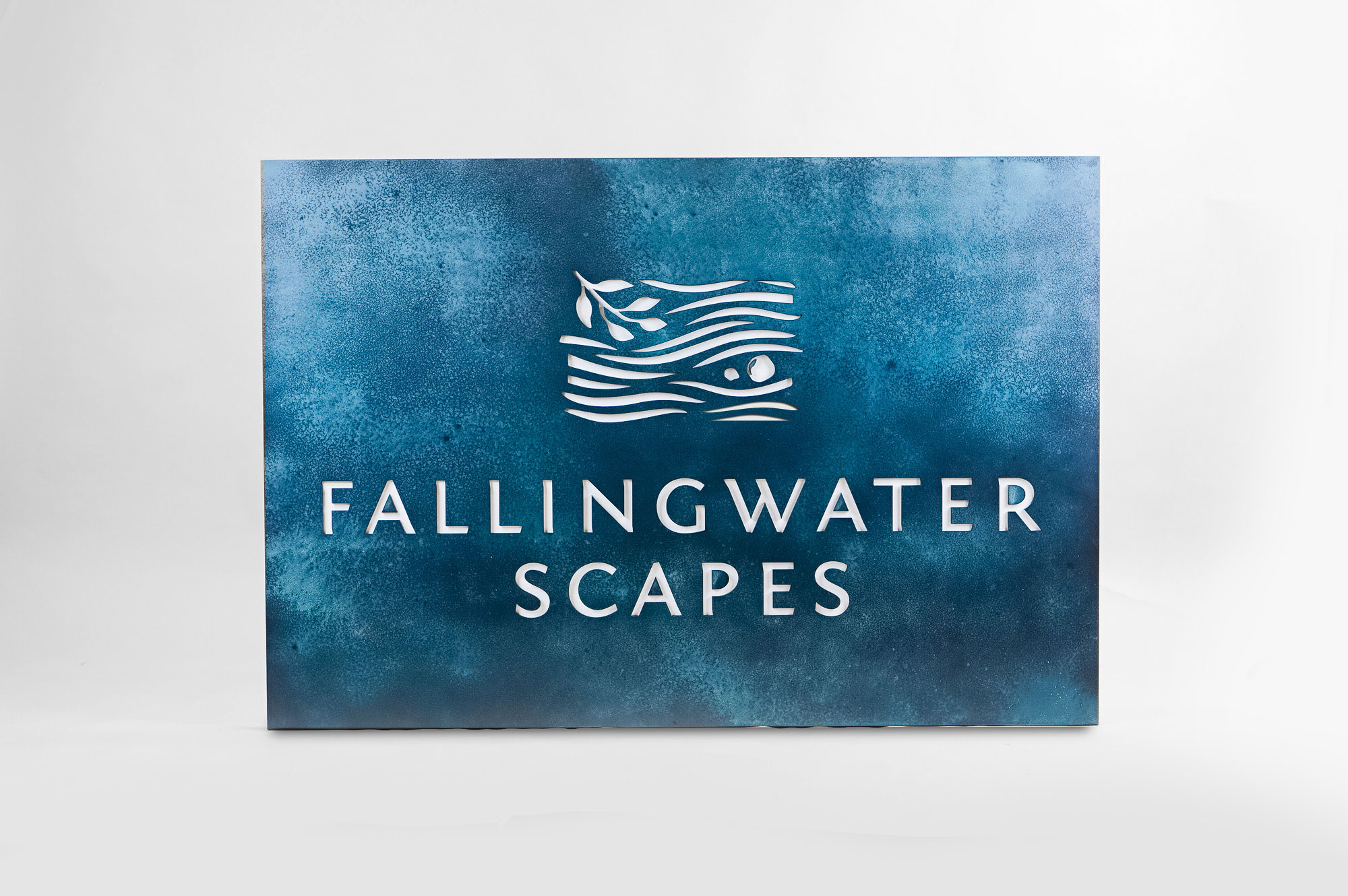 Blue-hued, rusted bronze/brass/copper patina style sign for FallingWater Scapes, a water feature design, construction and maintenance company in Dover, MA. Blue-hued, rusted bronze/brass/copper patina style sign for FallingWater Scapes, a water feature design, construction and maintenance company in Dover, MA.