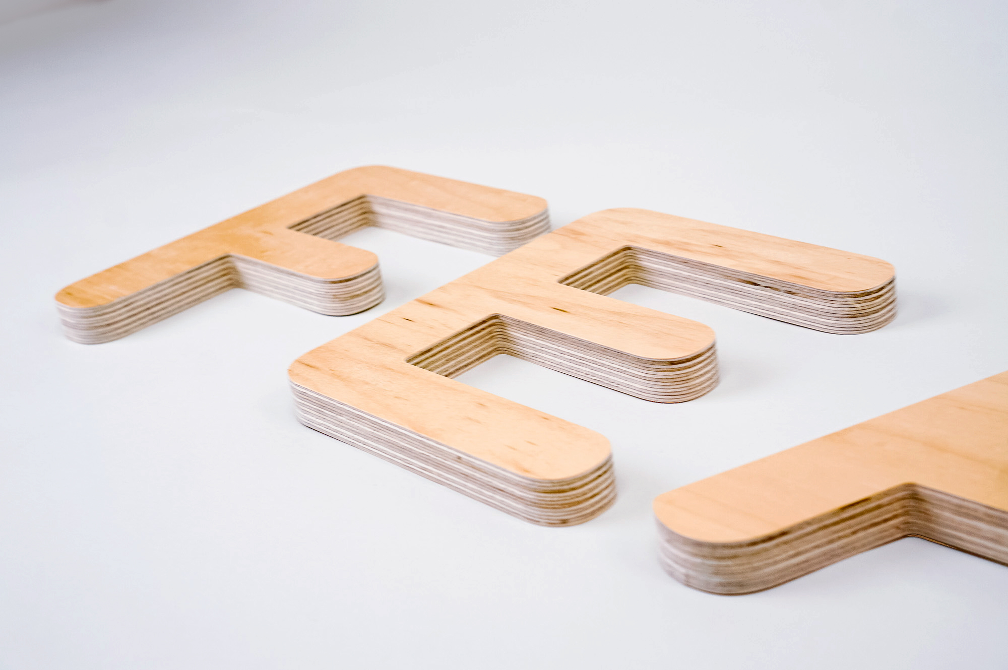 CNC routed plywood letters for Feather, furniture renting service. CNC routed plywood letters for Feather, furniture renting service.