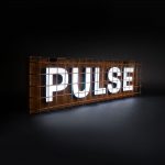 Industrial, caged, rusty metal illuminated sign for Pulse, a fitness studio at Newtown Athletic Club, a premiere family fitness and wellness center serving residents of Newtown, PA