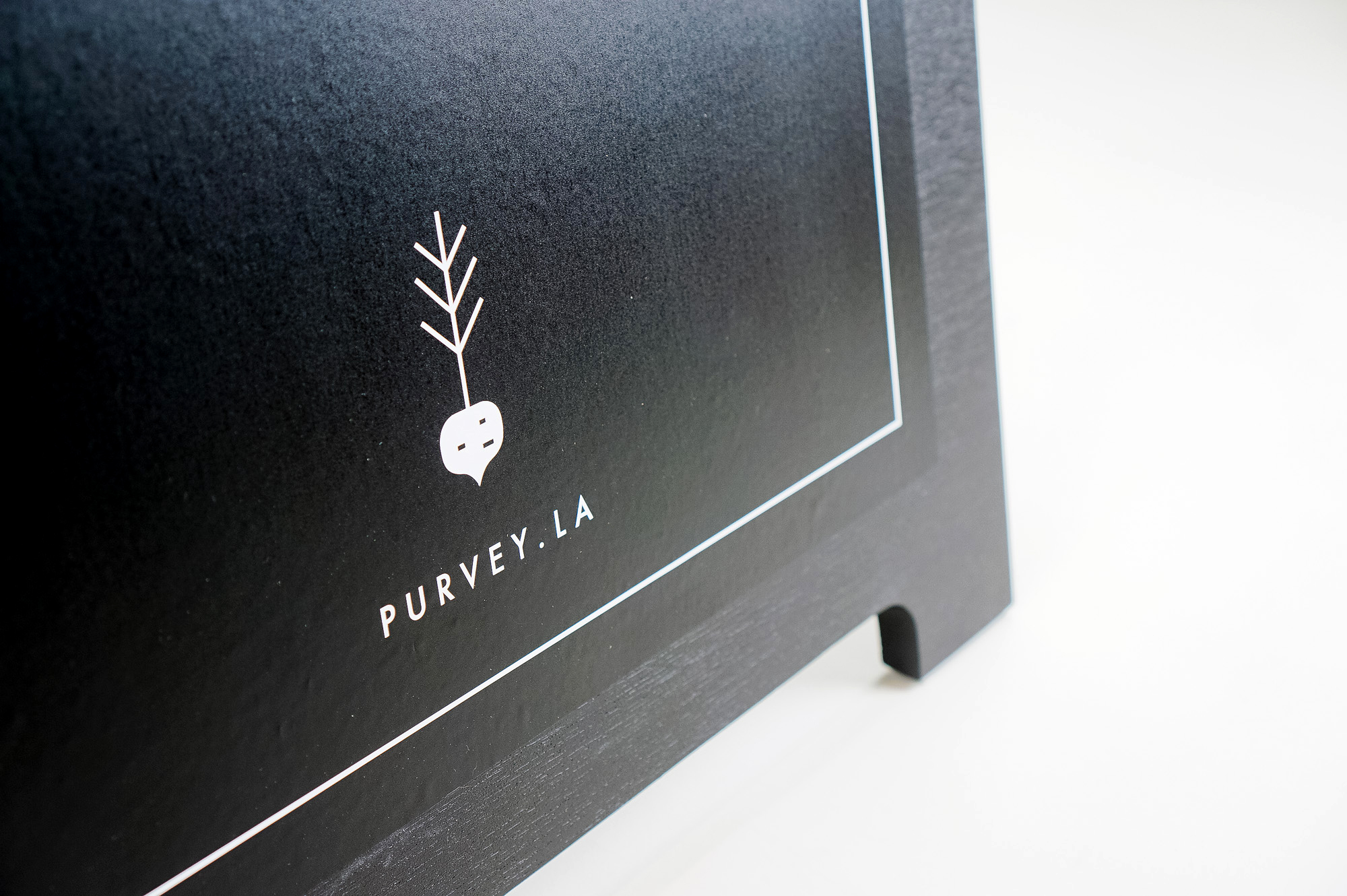 All black modern chalkboard sidewalk/farmer's market a-frame sign for Purvey, a Los Angeles based business delivering ready-to-eat, family-style meals to offices and families.