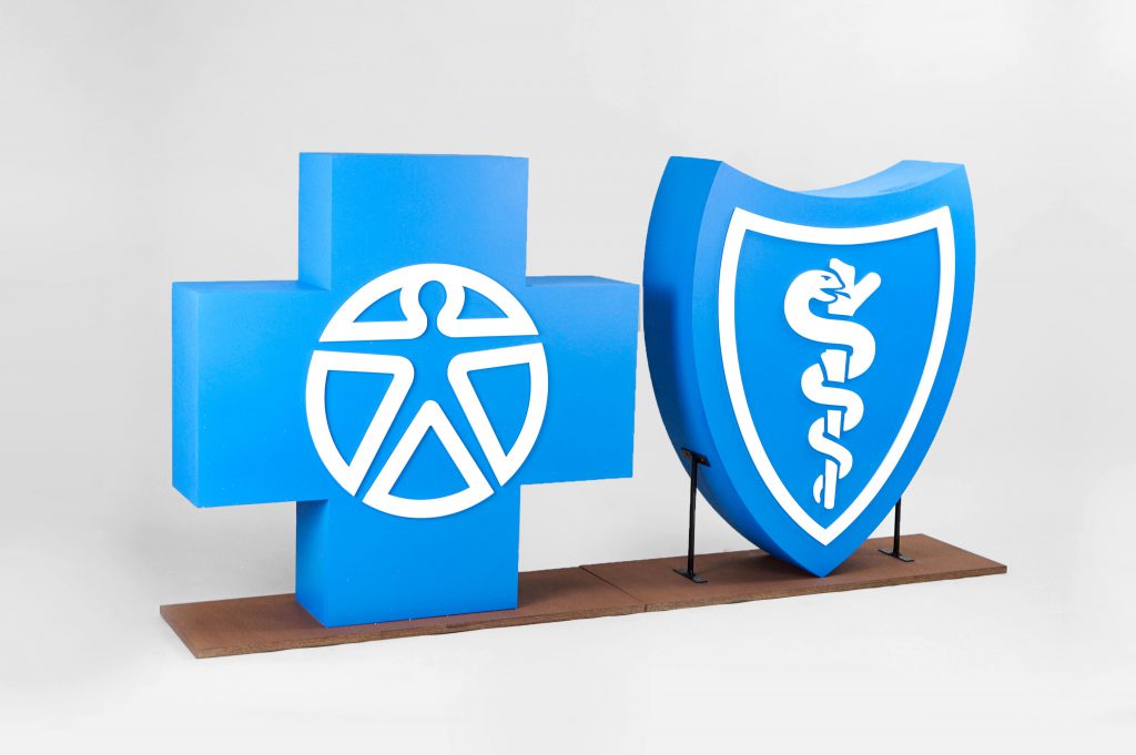 Large scale blue and white Blue Cross Blue Shield foam freestanding event logos for Aspen Event Works, a boutique event planning company specializing in creative and memorable event experiences.