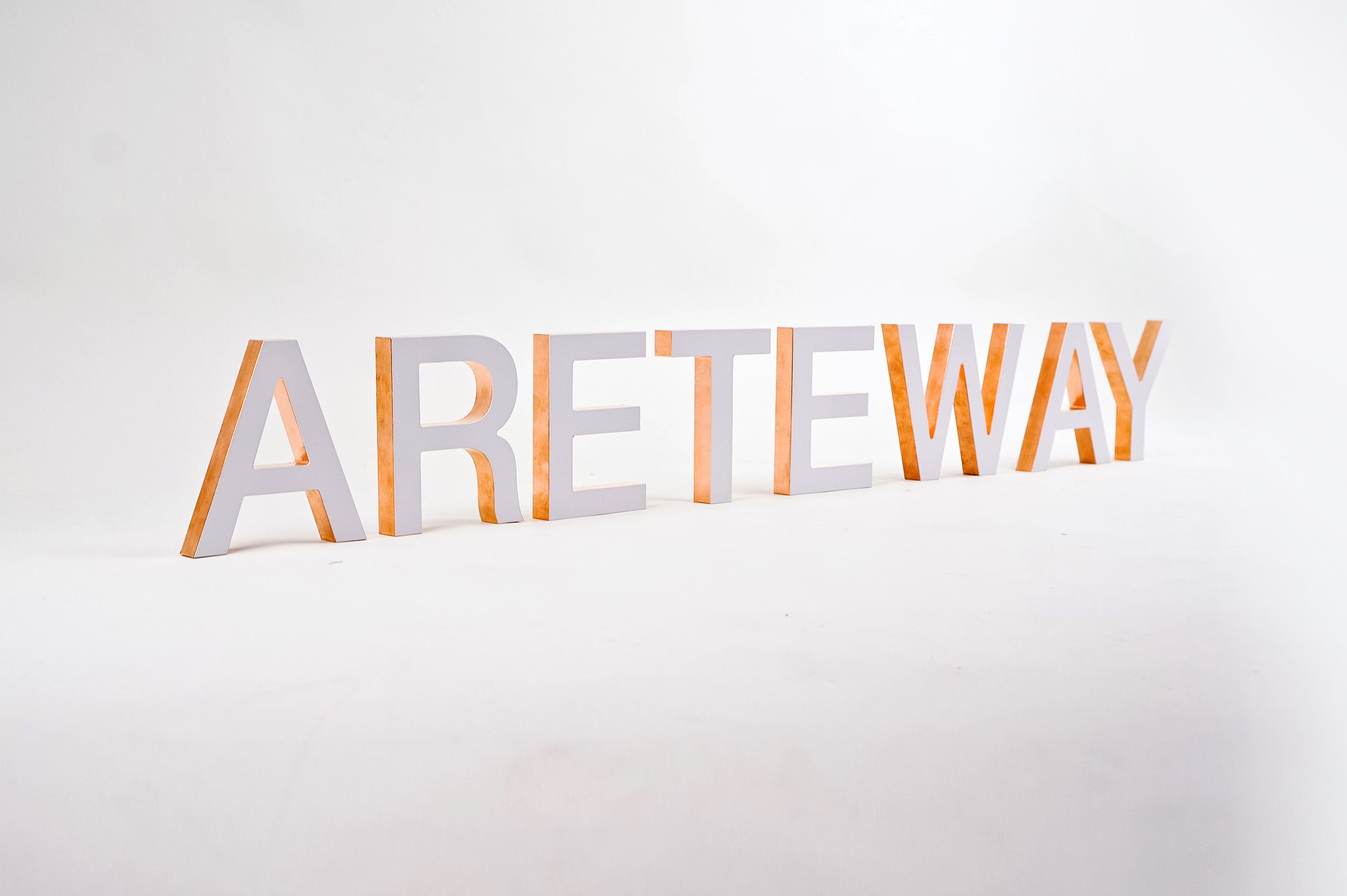 White letters with copper edges for Areteway, a clothing and gift boutique in Santa Rosa, CA.