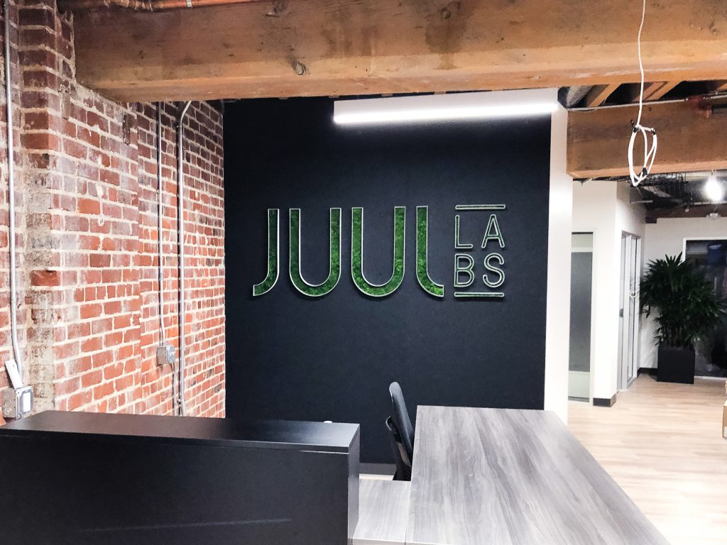 Moss filled lobby sign for the San Francisco office of Juul, an electronic cigarette company.