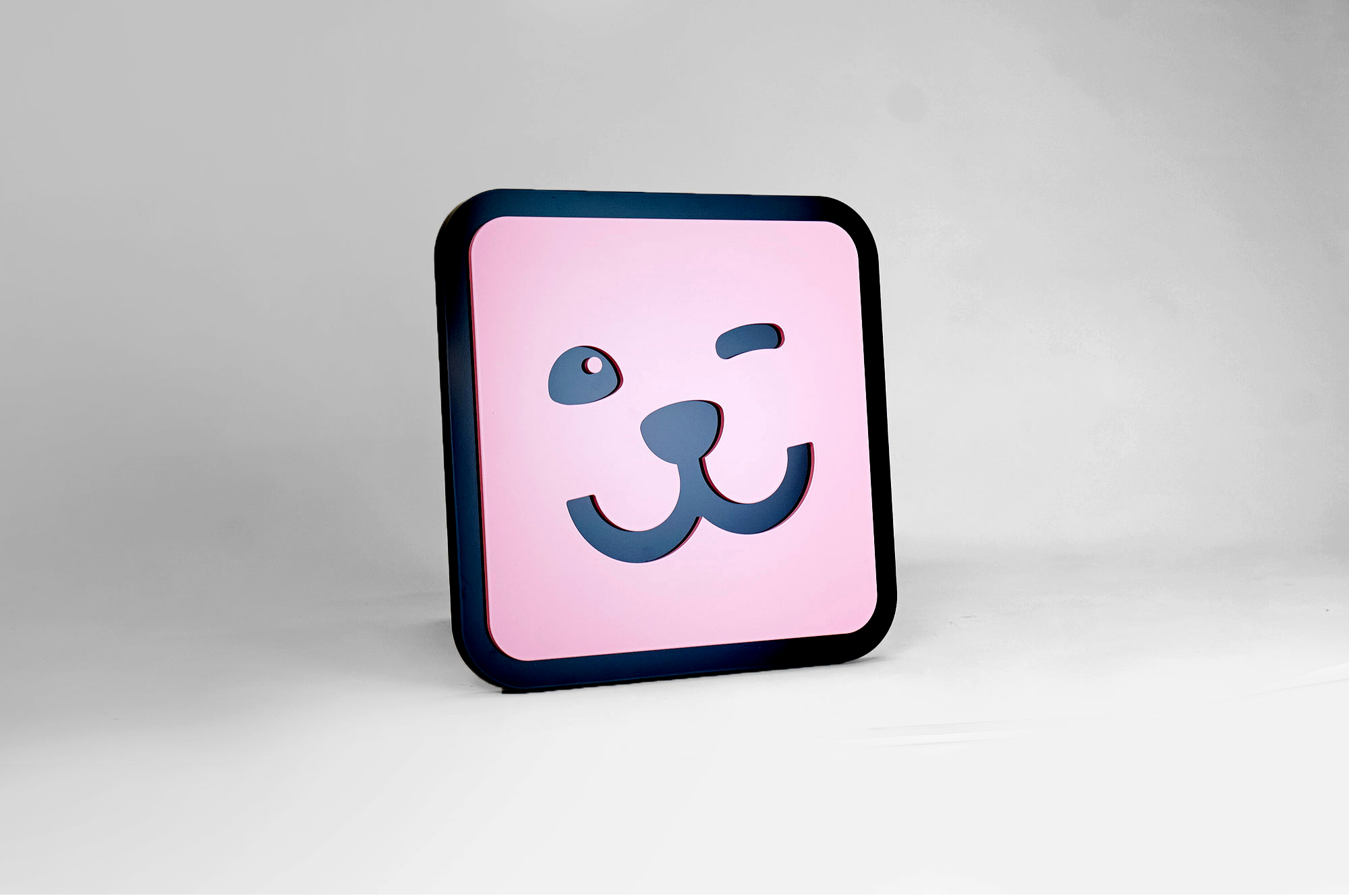 Dimensional pink app icon sign for Pawp, personalized platform to manage your pet's life and discover curated products and services.