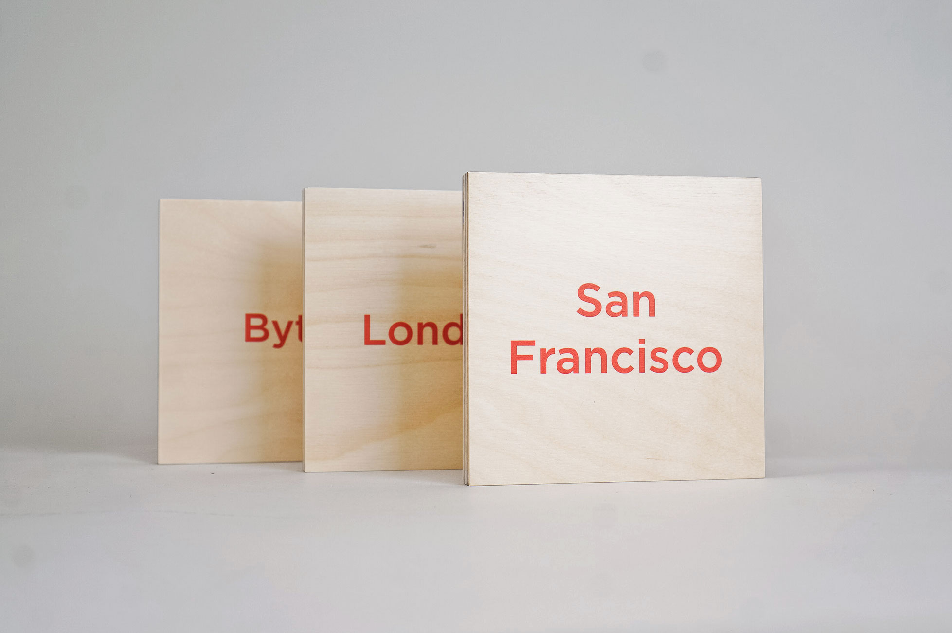 Light wood room signs with red text for PubNub, a global Data Stream Network and realtime infrastructure-as-a-service company based in San Francisco, California.