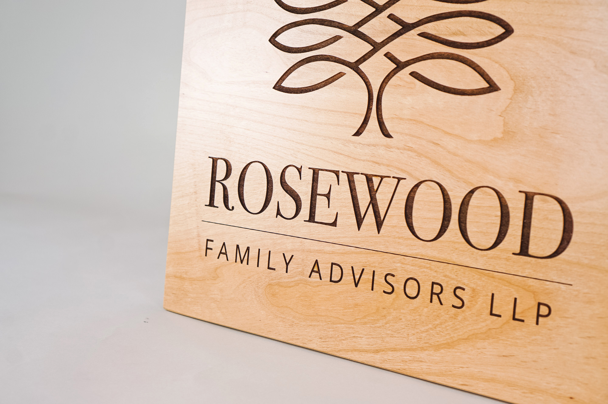 Etched light wood sign for Rosewood Family Advisors, a Palo Alto based company offering a diverse range of family office services. Etched light wood sign for Rosewood Family Advisors, a Palo Alto based company offering a diverse range of family office services.
