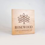 Etched light wood sign for Rosewood Family Advisors, a Palo Alto based company offering a diverse range of family office services.