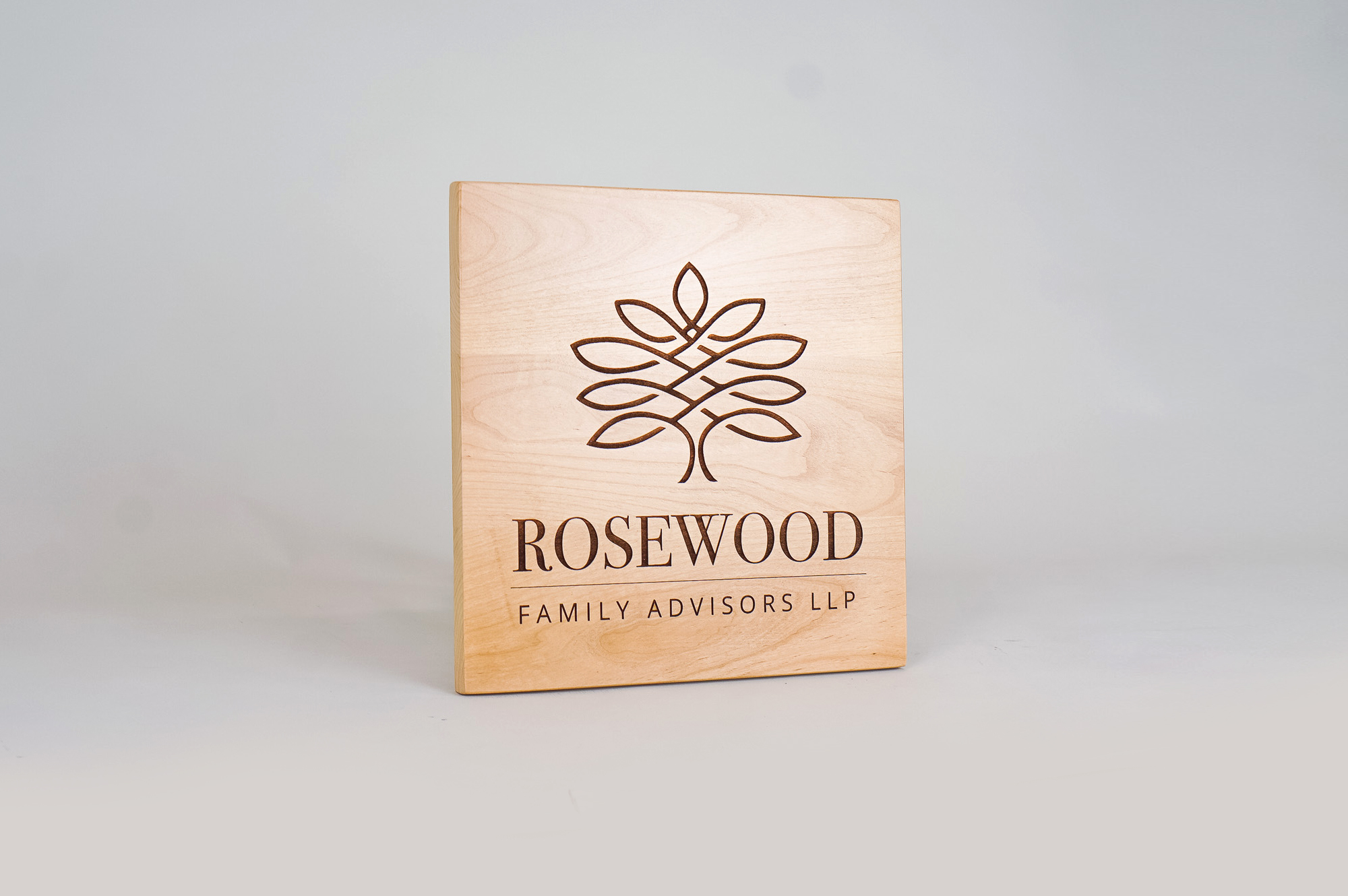 Etched light wood sign for Rosewood Family Advisors, a Palo Alto based company offering a diverse range of family office services. Etched light wood sign for Rosewood Family Advisors, a Palo Alto based company offering a diverse range of family office services.