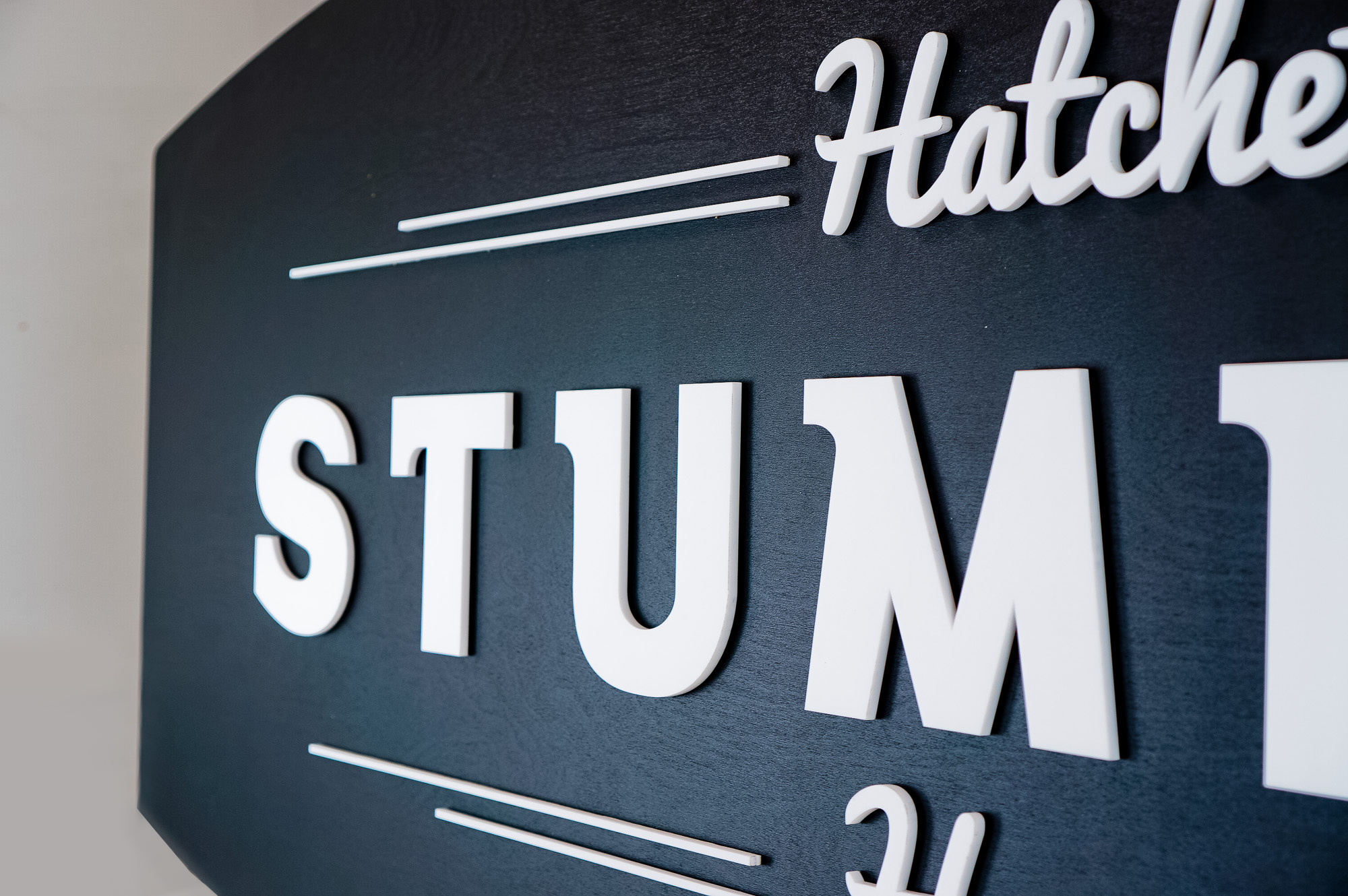 Black and white raised panel sign for Stumpy’s, the first hatchet throwing venue in the U.S. Black and white raised panel sign for Stumpy's, the first hatchet throwing venue in the U.S.