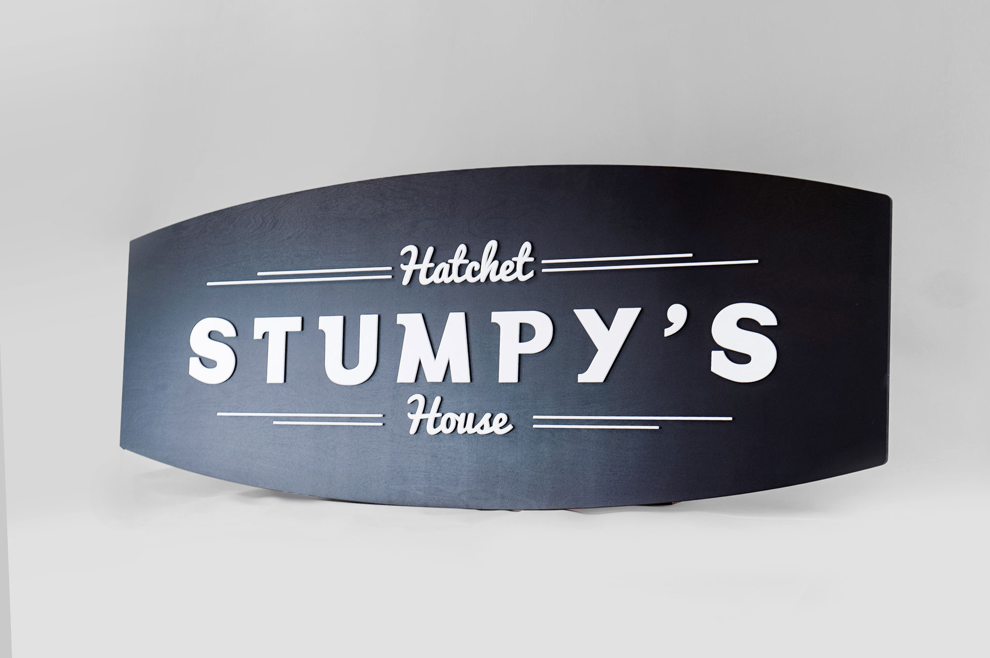 Black and white raised panel sign for Stumpy’s, the first hatchet throwing venue in the U.S. Black and white raised panel sign for Stumpy's, the first hatchet throwing venue in the U.S.