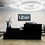 Black and white lobby sign for Uber, an American multinational transportation network company.