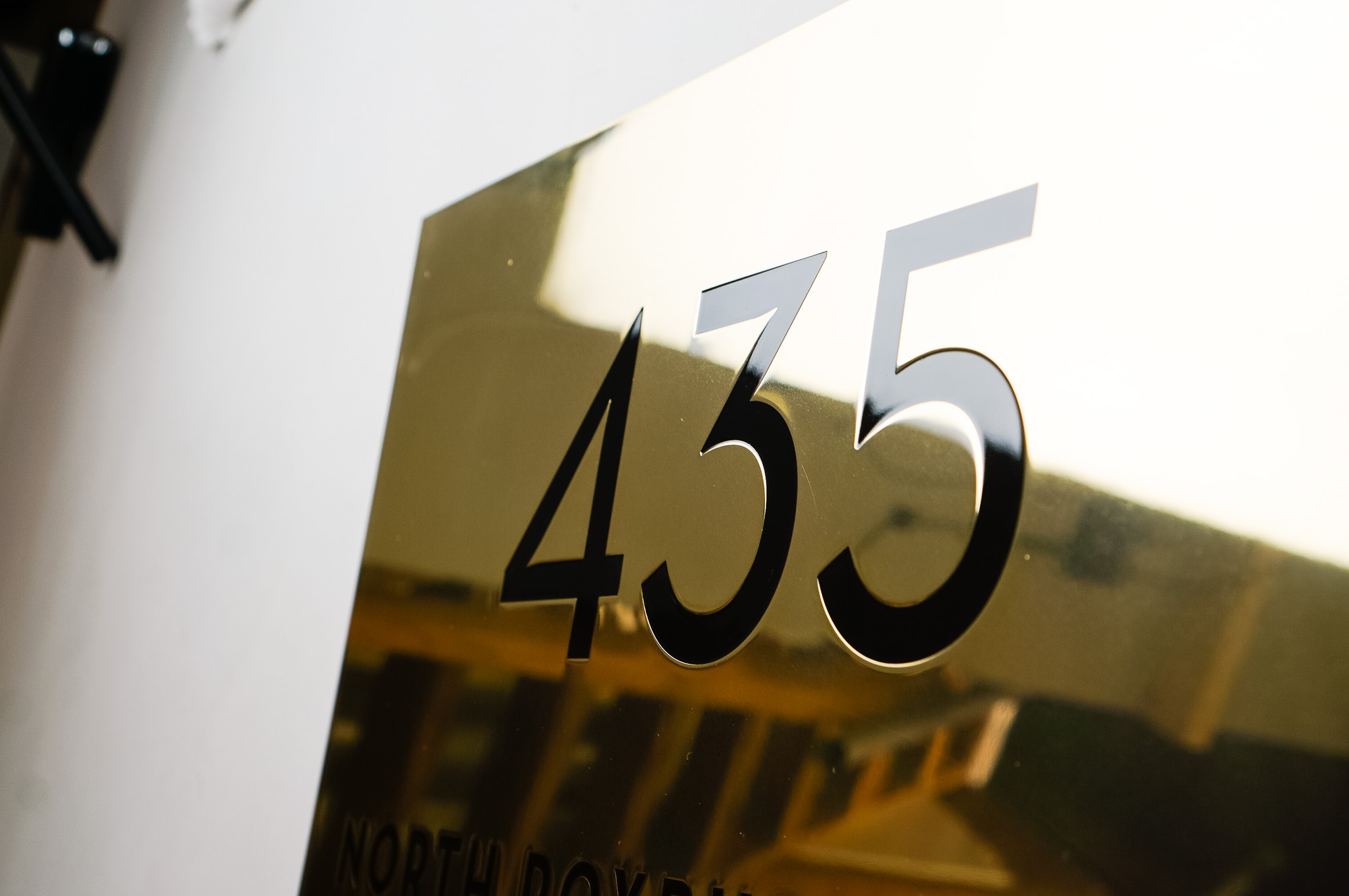 Classic style, solid brass exterior address sign for Mickey’s Fine Pharmacy, a Beverly Hills landmark. Classic style, solid brass exterior address sign for Mickey's Fine Pharmacy, a Beverly Hills landmark.