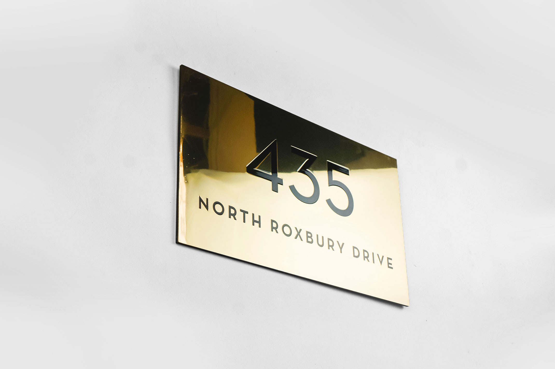 Classic style, solid brass exterior address sign for Mickey’s Fine Pharmacy, a Beverly Hills landmark. Classic style, solid brass exterior address sign for Mickey's Fine Pharmacy, a Beverly Hills landmark.
