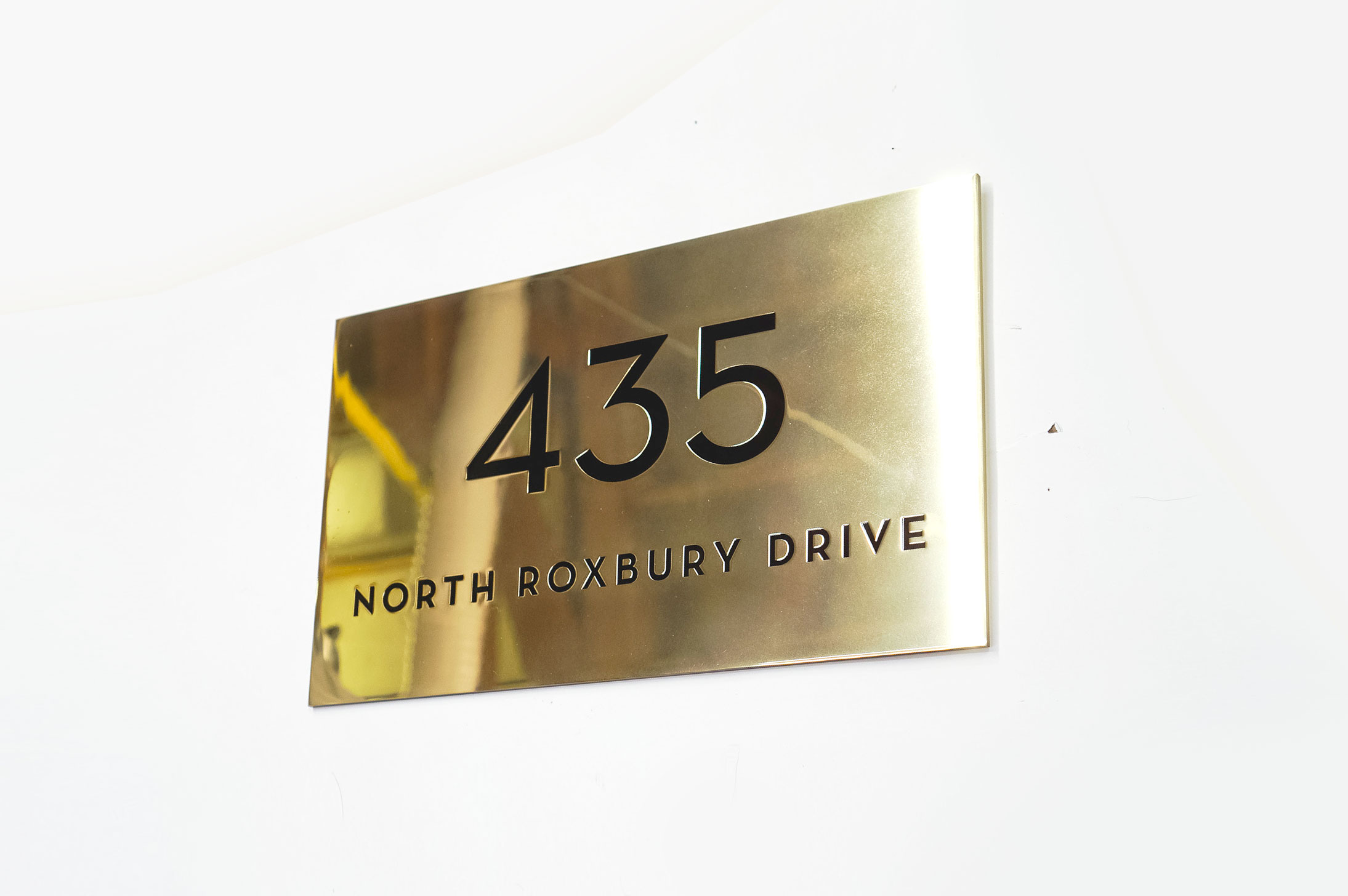 Classic style, solid brass exterior address sign for Mickey’s Fine Pharmacy, a Beverly Hills landmark. Classic style, solid brass exterior address sign for Mickey's Fine Pharmacy, a Beverly Hills landmark.