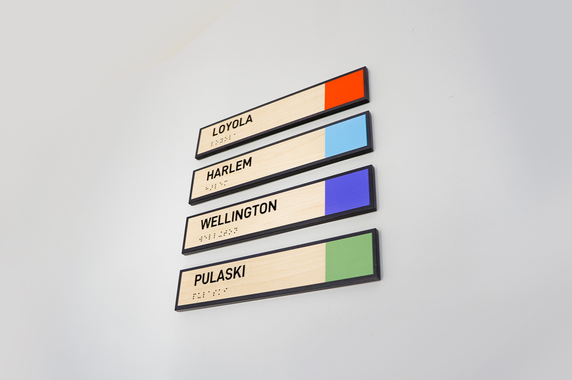 Light wood, color-coded phone booth signs for G2, a company that compares business software and services based on user ratings.