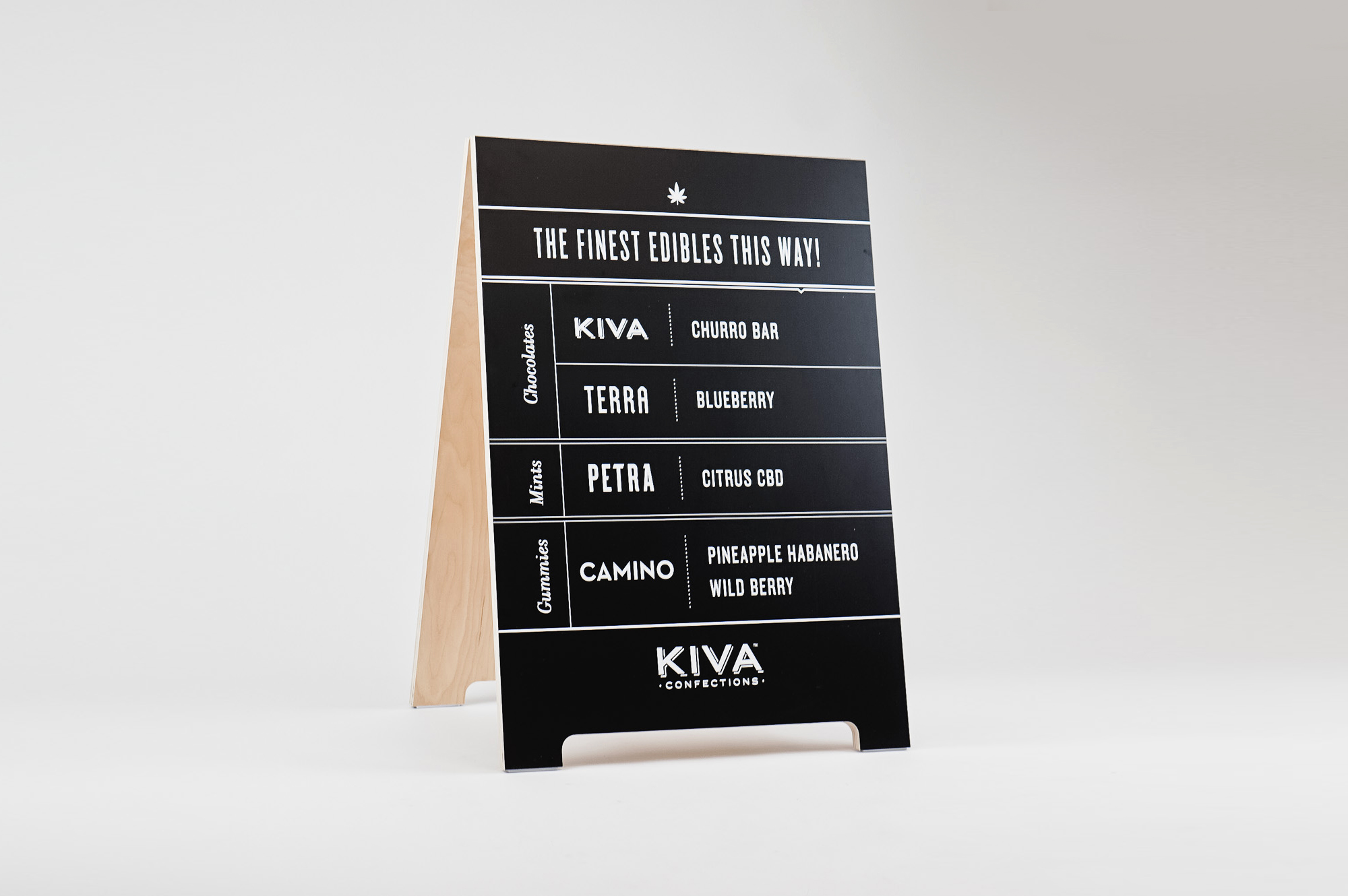 Black and white A-frame menu sign for the Outside Lands booth of Kiva, creators of delicious varieties of cannabis-infused confections. Black and white A-frame menu sign for the Outside Lands booth of Kiva, creators of delicious varieties of cannabis-infused confections.