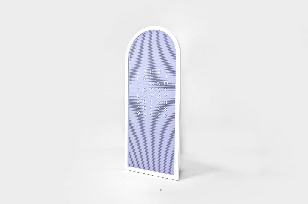 Custom purple changeable letterboard sign for Re:Store, a retail store and community space on Maiden Lane in San Francisco, CA.