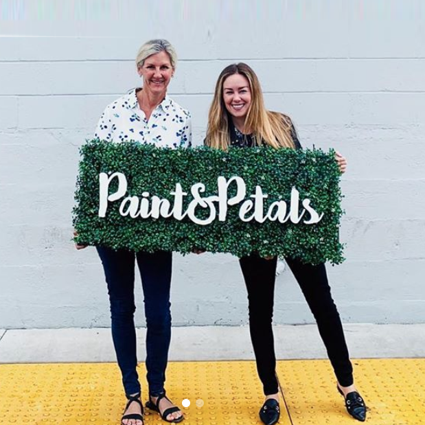 Faux boxwood sign with white script text for Paint & Petals, a California-based housewares collection created from Bridgette Thornton’s hand-painted designs.