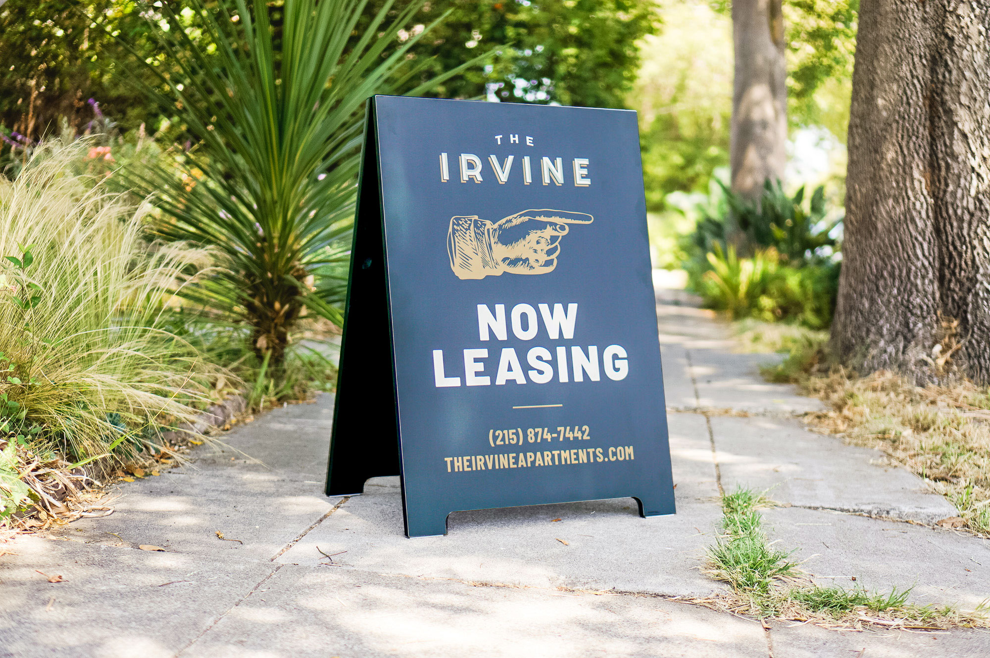 Emerald green and gold A-frame sign for The Irvine, a luxury apartment building in Philadelphia. Emerald green and gold A-frame sign for The Irvine, a luxury apartment building in Philadelphia.