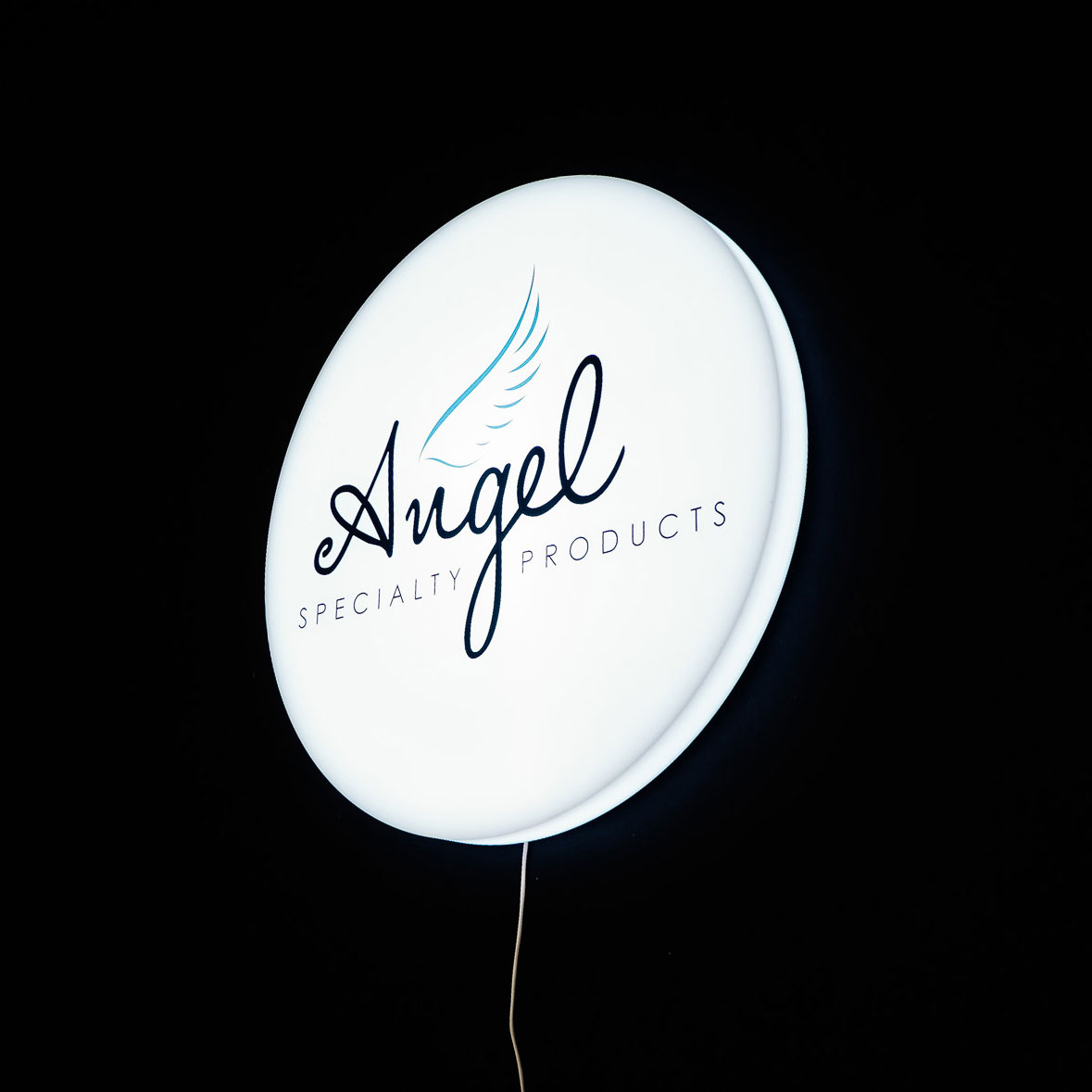 Illuminated, circular, face-lit sign for Angel Specialty Products