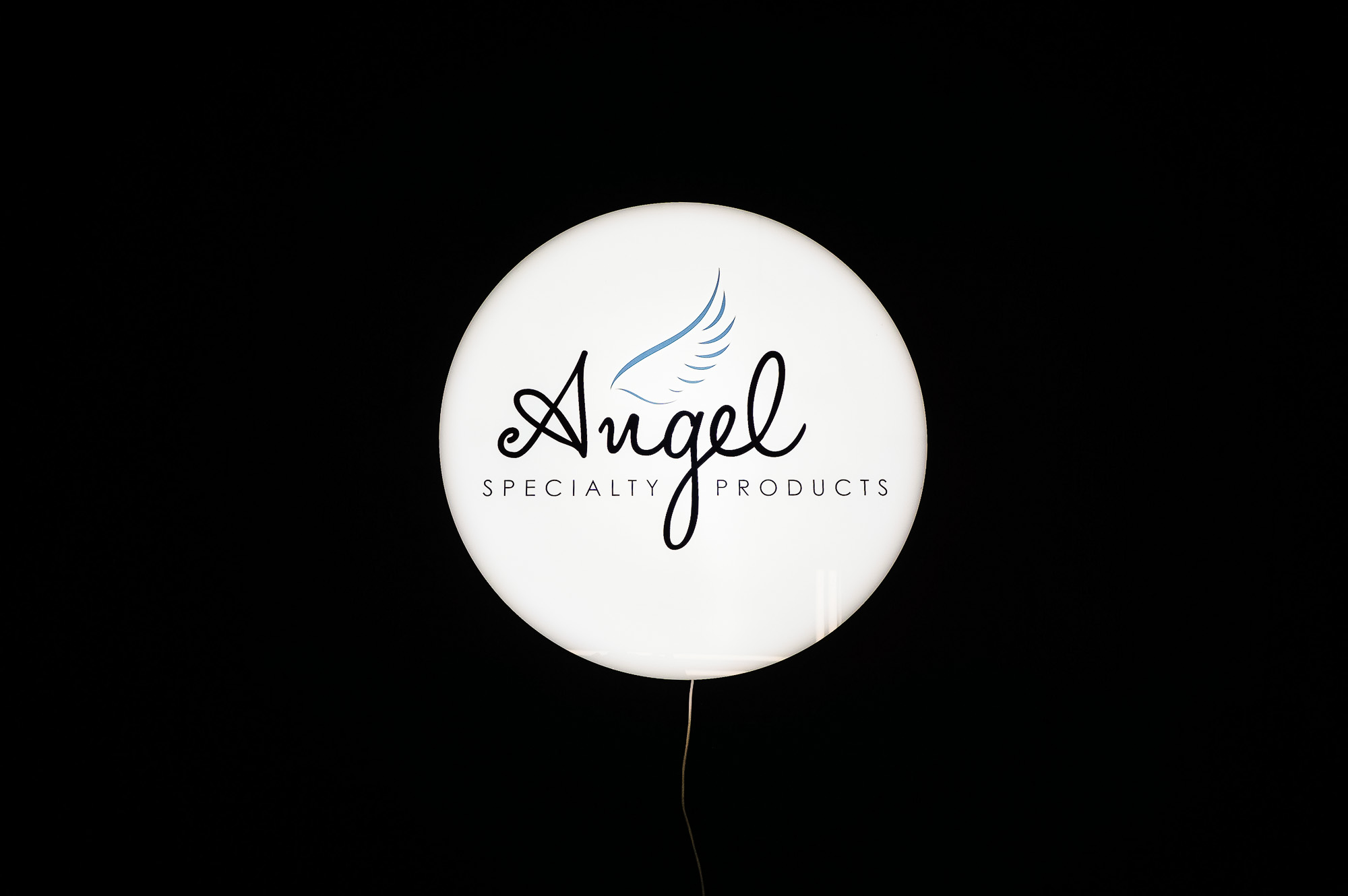 Illuminated, circular, face-lit sign for Angel Specialty Products
