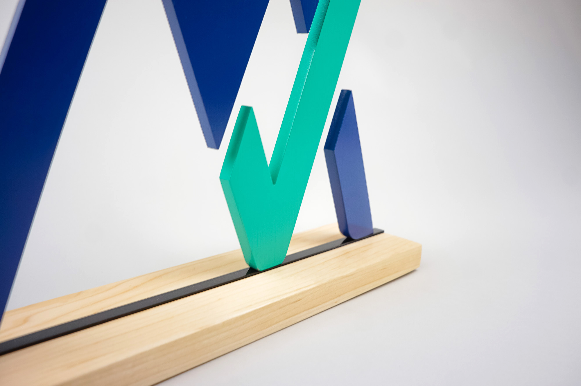 Freestanding blue and green logo on wood base for the office of MyVest, a company building enterprise wealth management technology for the digital age. Freestanding blue and green logo on wood base for the office of MyVest, a company building enterprise wealth management technology for the digital age.