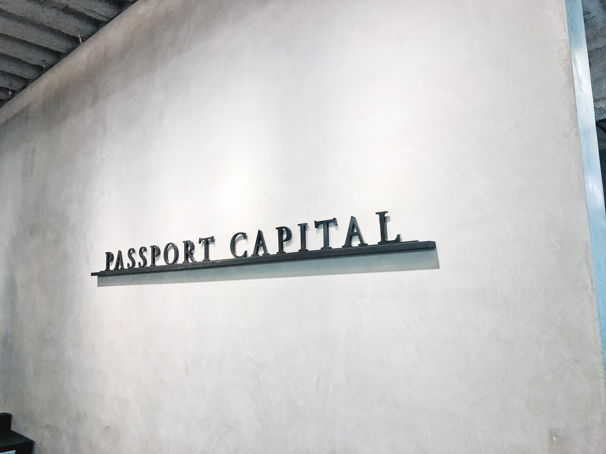 Black letters on shelf against concrete lobby wall at Passport Capital, a San Francisco-based, global thematic investment firm. Black letters on shelf against concrete lobby wall at Passport Capital, a San Francisco-based, global thematic investment firm.