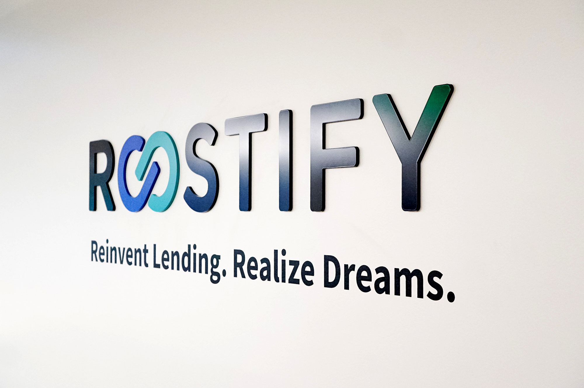 Dimensional, full color logo on white wall in lobby and elevator vestibule for the San Francisco office of Roostify, an integrated digital mortgage software platform. Dimensional, full color logo on white wall in lobby and elevator vestibule for the San Francisco office of Roostify, an integrated digital mortgage software platform.