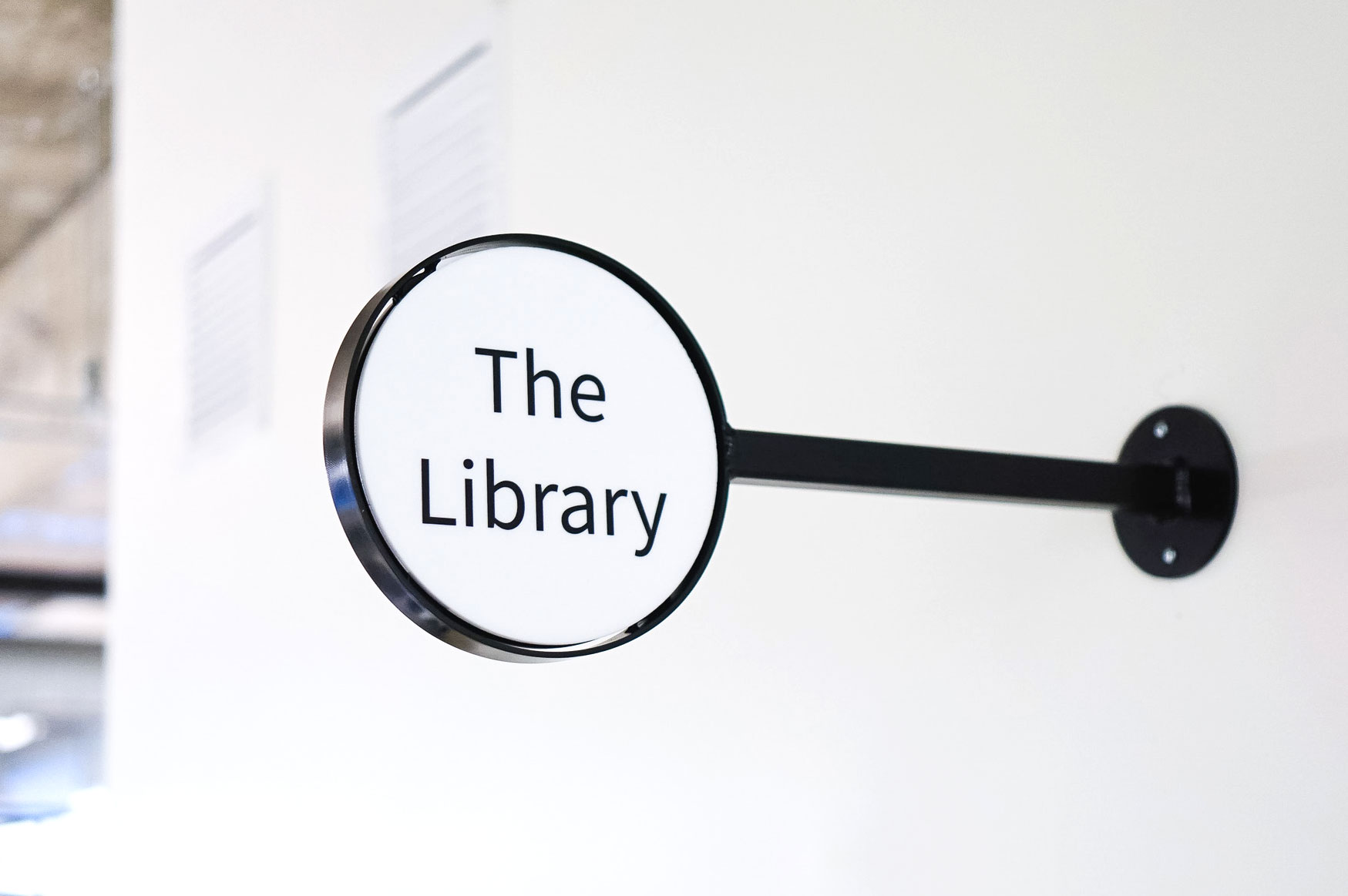 Retro, circular, black and white library blade sign for the San Francisco office of Roostify, an integrated digital mortgage software platform. Retro, circular, black and white library blade sign for the San Francisco office of Roostify, an integrated digital mortgage software platform.