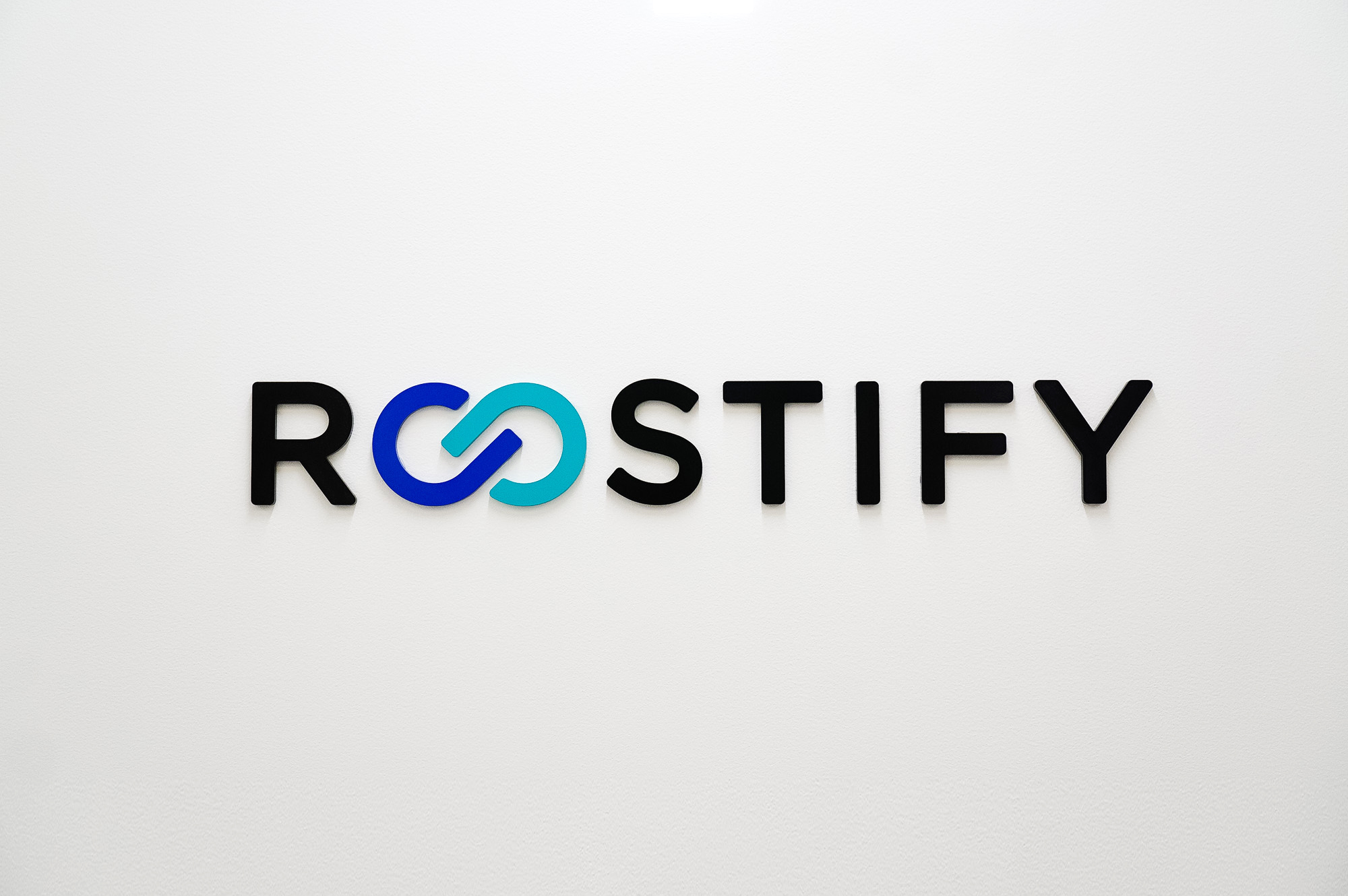 Dimensional, full color logo on white wall in lobby and elevator vestibule for the San Francisco office of Roostify, an integrated digital mortgage software platform. Dimensional, full color logo on white wall in lobby and elevator vestibule for the San Francisco office of Roostify, an integrated digital mortgage software platform.