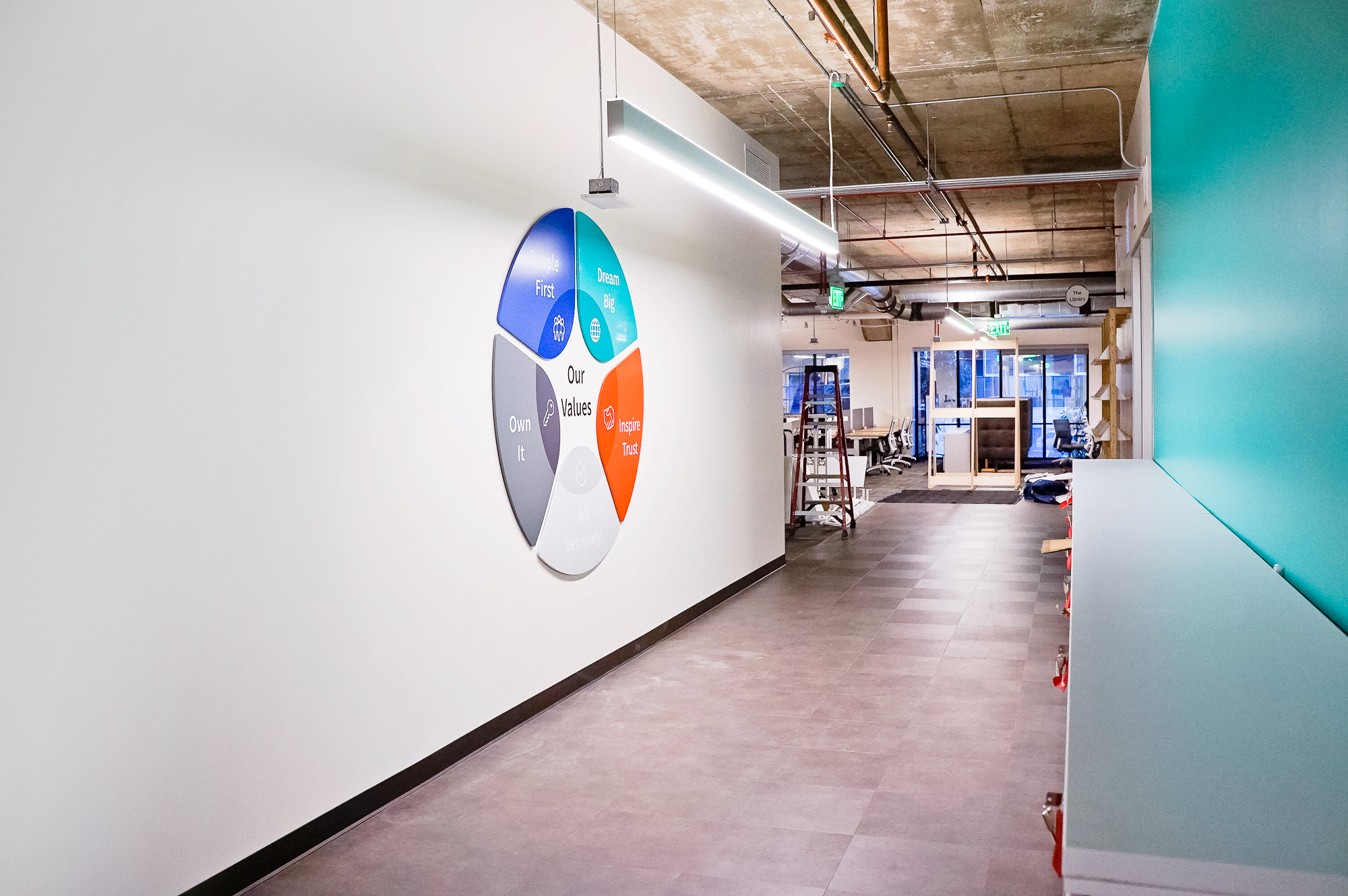 Dimensional, full-color company values graphic on white wall in the San Francisco office of Roostify, an integrated digital mortgage software platform. Dimensional, full-color company values graphic on white wall in the San Francisco office of Roostify, an integrated digital mortgage software platform.
