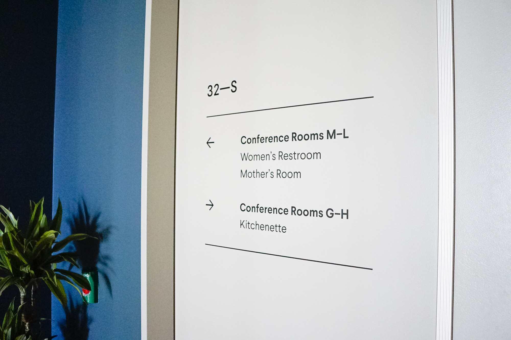Matte white vinyl wayfinding sign with dark grey text for a San Francisco office of Slack, an American cloud-based set of proprietary team collaboration tools and services. Matte white vinyl wayfinding sign with dark grey text for a San Francisco office of Slack, an American cloud-based set of proprietary team collaboration tools and services.
