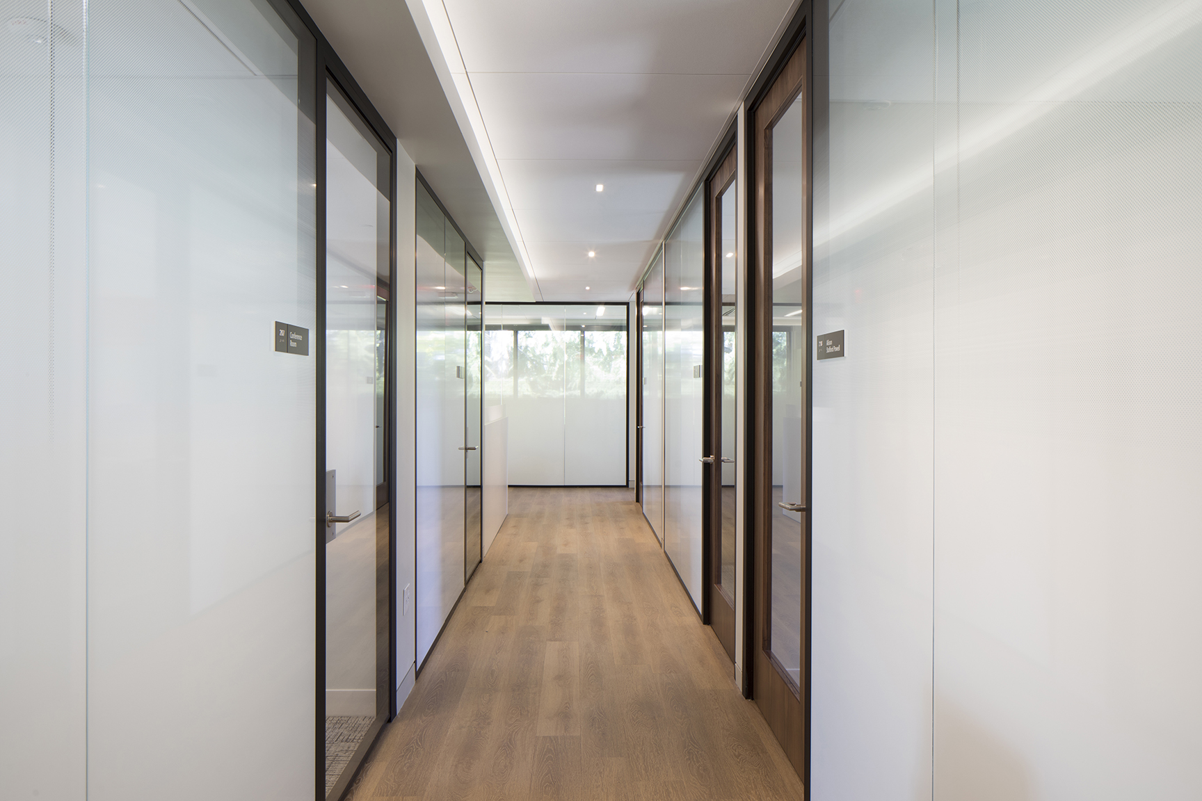 Changeable, minimal grey office ADA nameplate signs for Baker McKenzie, a multinational law firm. Changeable, minimal grey office ADA nameplate signs for Baker McKenzie, a multinational law firm.
