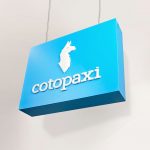 Blue boxed overhead retail sign with white artwork for Cotopaxi, a company that creates innovative outdoor products and experiences.