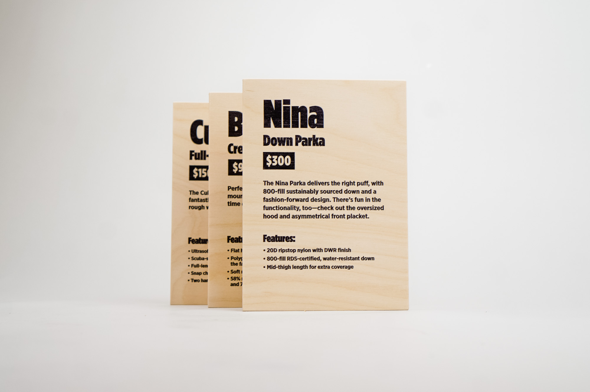 Light wood, pop-up shop product signs for Cotopaxi, a company that creates innovative outdoor products and experiences. Light wood, pop-up shop product signs for Cotopaxi, a company that creates innovative outdoor products and experiences.