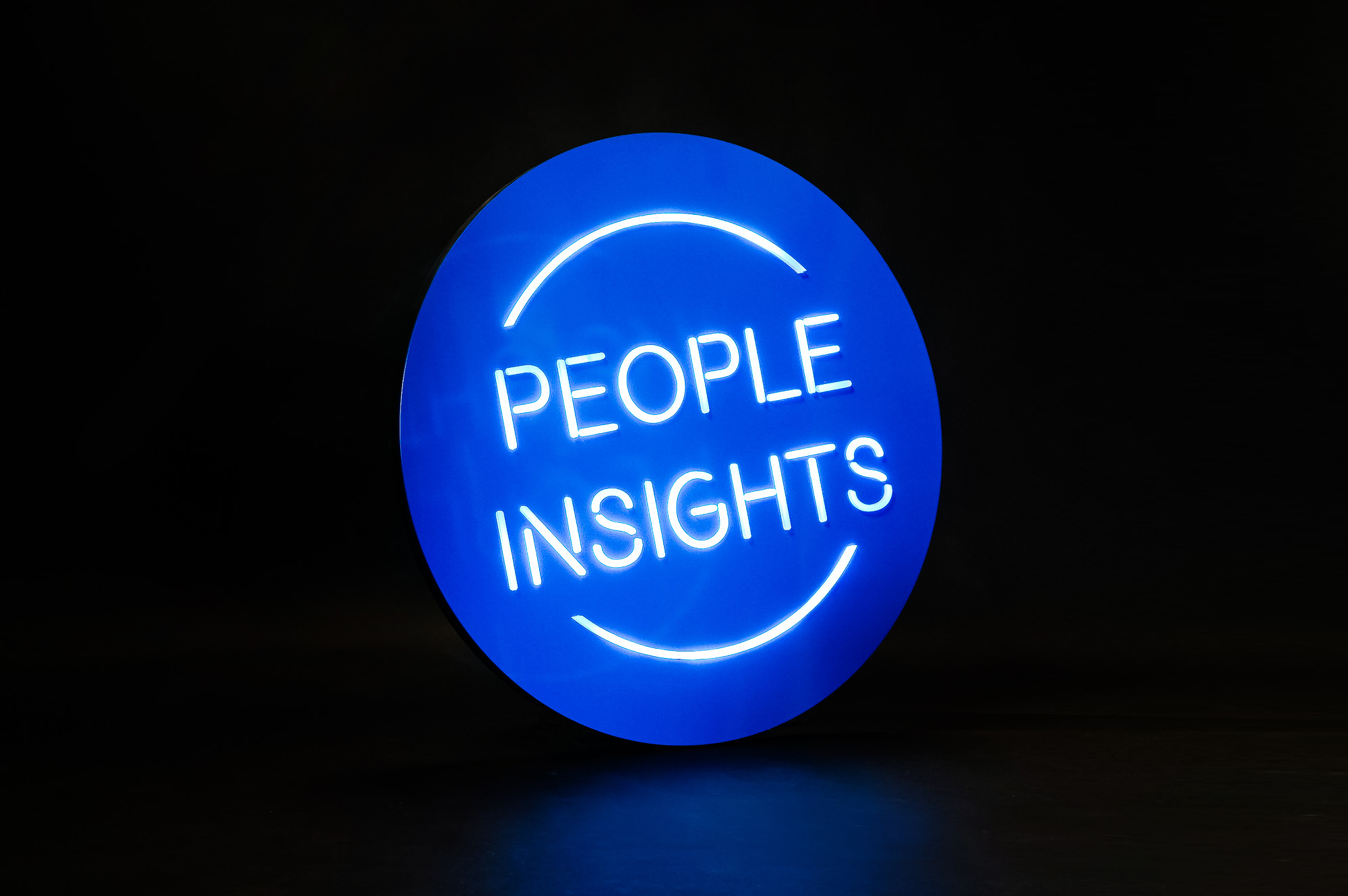Blue neon-style team sign for Facebook, an American online social media and social networking service company. Blue neon-style team sign for Facebook, an American online social media and social networking service company.