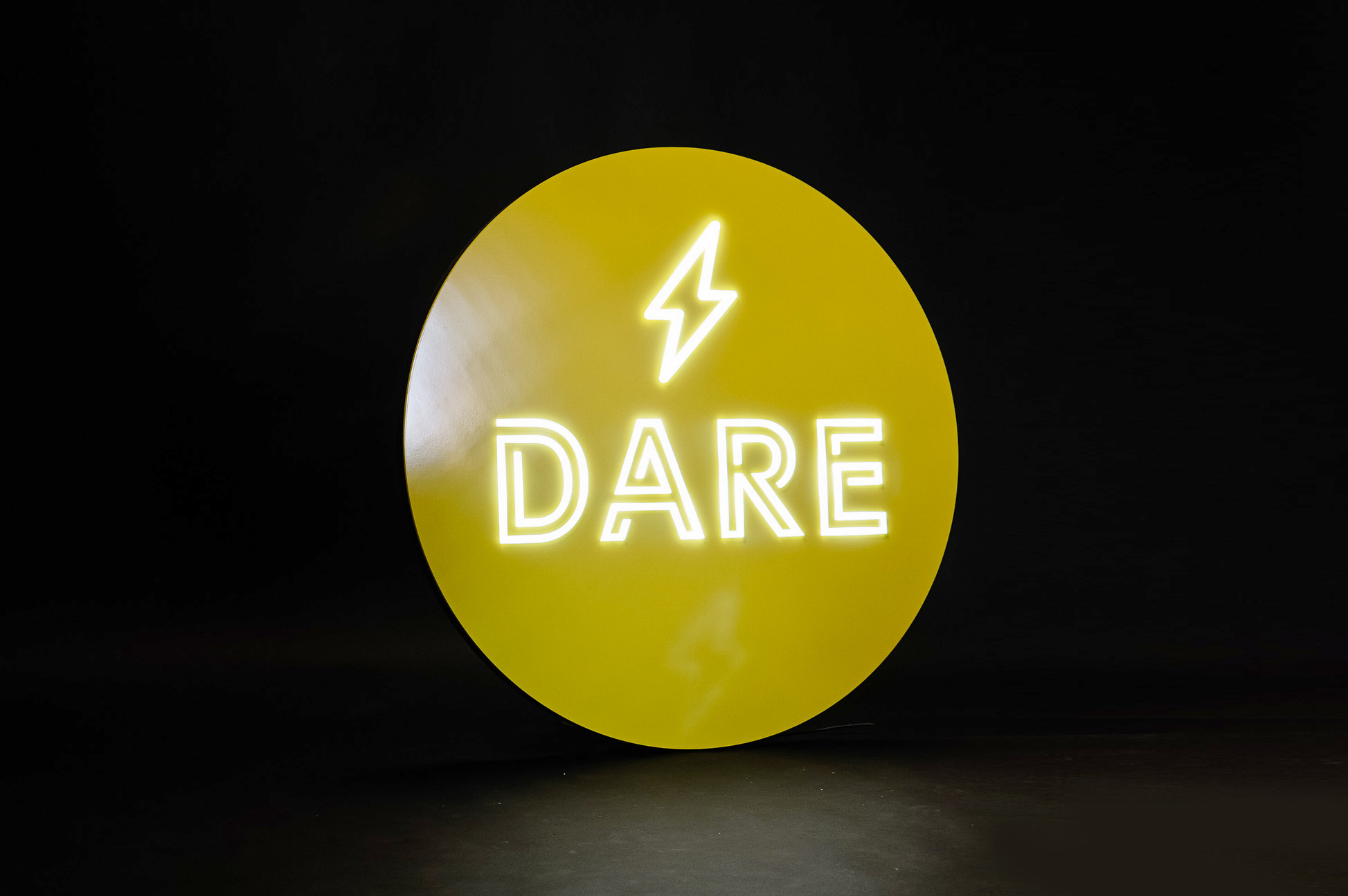 Yellow neon-style team sign for Facebook, an American online social media and social networking service company. Yellow neon-style team sign for Facebook, an American online social media and social networking service company.