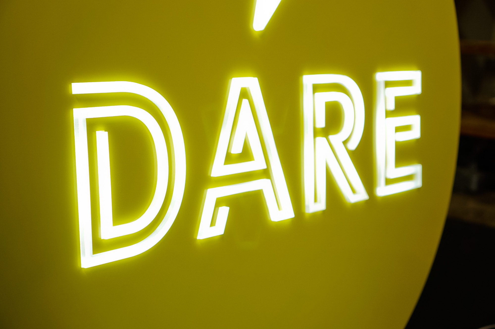 Yellow neon-style team sign for Facebook, an American online social media and social networking service company. Yellow neon-style team sign for Facebook, an American online social media and social networking service company.