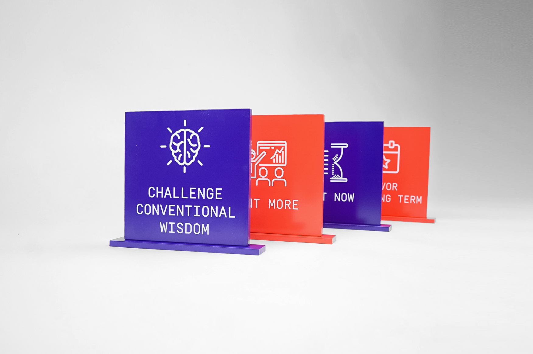 Red and purple painted tabletop company value plaques for the San Francisco office of Gong, makers of a conversation intelligence platform for sales. Red and purple painted tabletop company value plaques for the San Francisco office of Gong, makers of a conversation intelligence platform for sales.