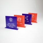 Red and purple painted tabletop company value plaques for the San Francisco office of Gong, makers of a conversation intelligence platform for sales.