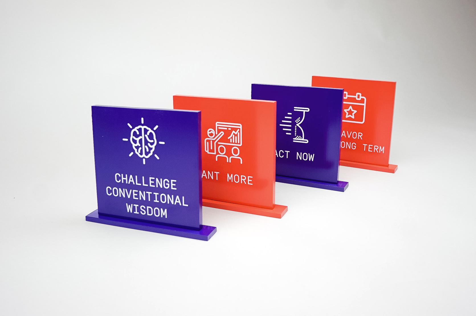 Red and purple painted tabletop company value plaques for the San Francisco office of Gong, makers of a conversation intelligence platform for sales. Red and purple painted tabletop company value plaques for the San Francisco office of Gong, makers of a conversation intelligence platform for sales.