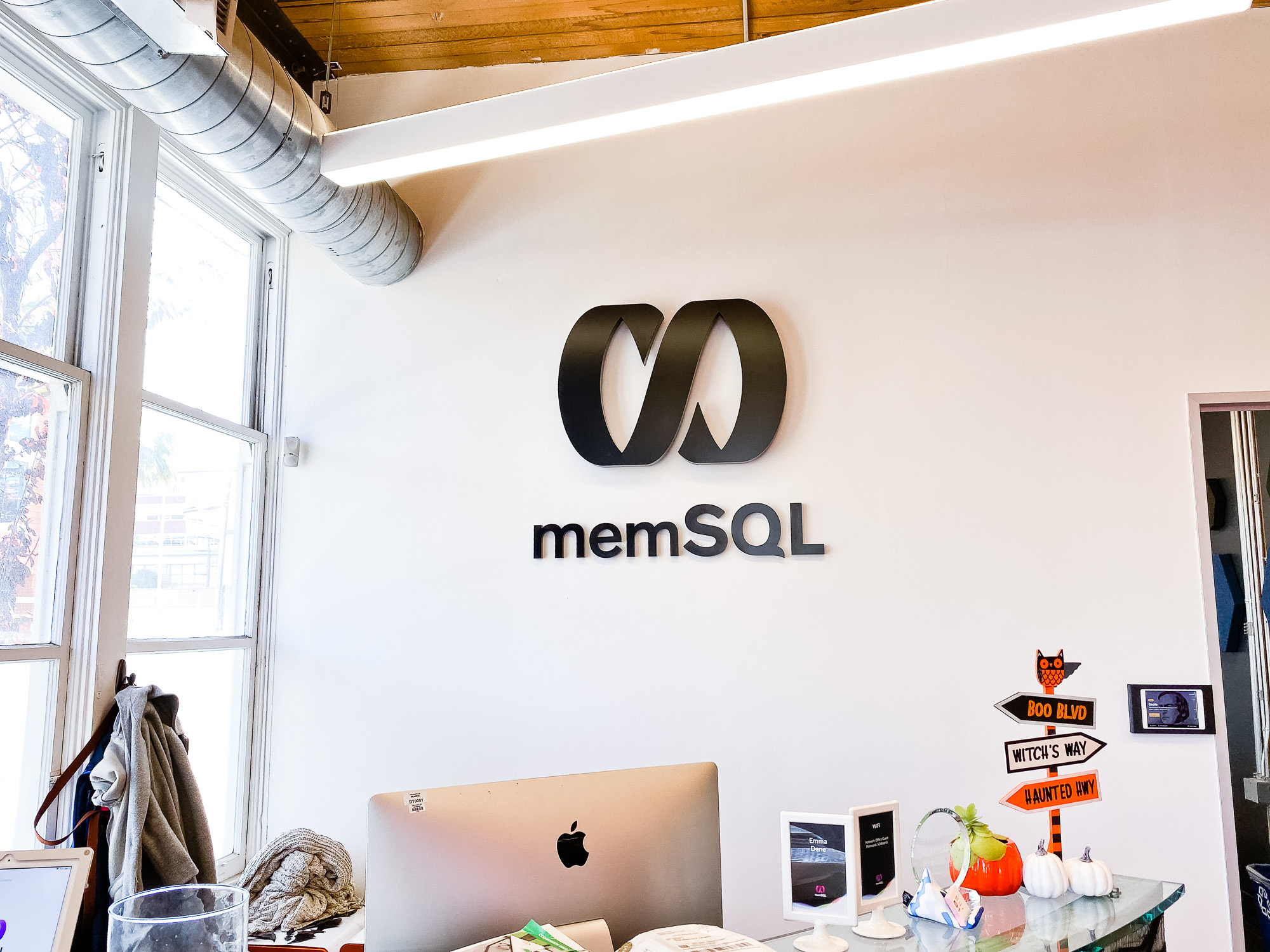 Illuminated black sign with back-lit purple lights for memSQL, a software company in San Francisco, California. Illuminated black sign with back-lit purple lights for memSQL, a software company in San Francisco, California.