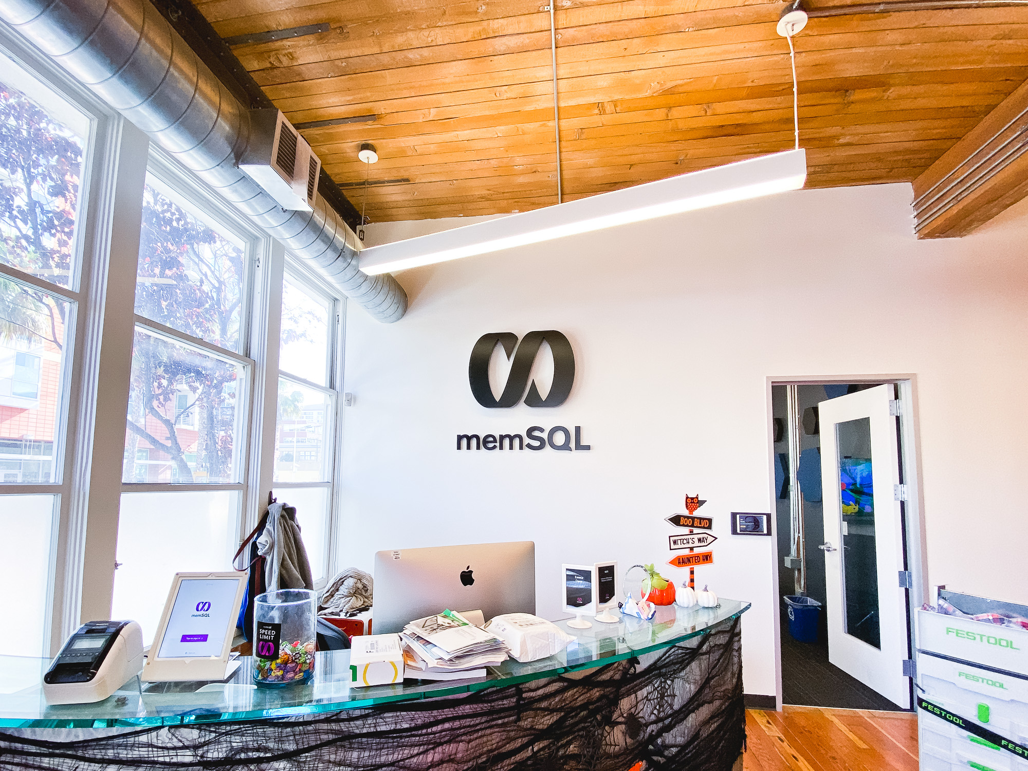 Illuminated black sign with back-lit purple lights for memSQL, a software company in San Francisco, California. Illuminated black sign with back-lit purple lights for memSQL, a software company in San Francisco, California.