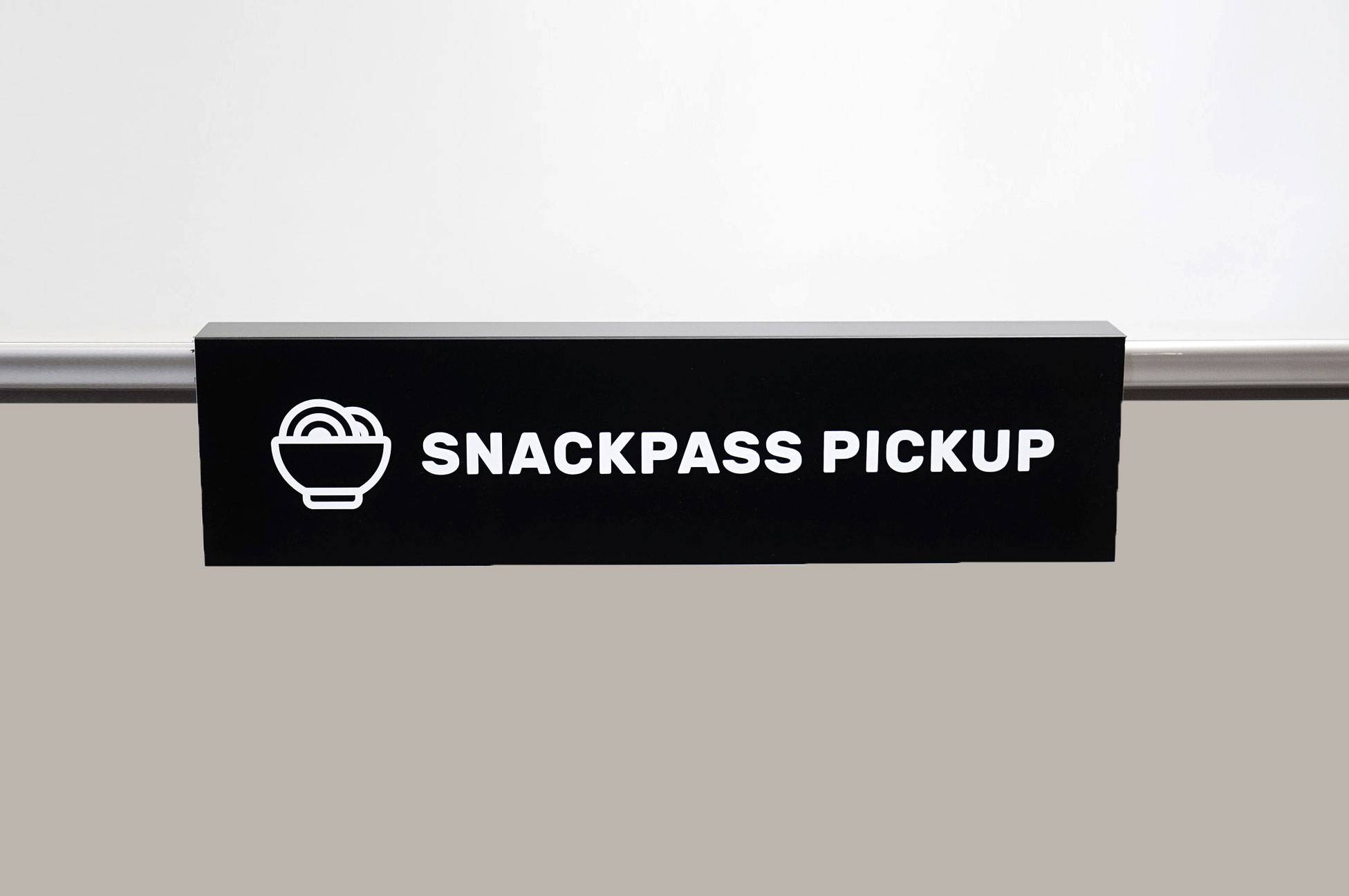 Overhanging black and white food pickup table sign for Snackpass, a social food app that makes ordering food more convenient, affordable and social. Overhanging black and white food pickup table sign for Snackpass, a social food app that makes ordering food more convenient, affordable and social.