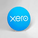 Circular blue shelf sign with white logo for Xero, a cloud-based accounting software platform for small and medium-sized businesses.