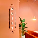 Multi-dimensional black and white "The Quiet Room" sign on salmon colored wall for the San Francisco expansion of The Wing, a network of work and community spaces designed for women.