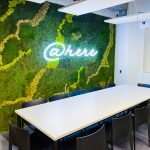 Neon-style @here sign on moss / living wall for the cafeteria/kitchen of Scale, a San Francisco based company delivering high quality training data for AI applications such as self-driving cars, mapping, AR/VR, robotics, and more.