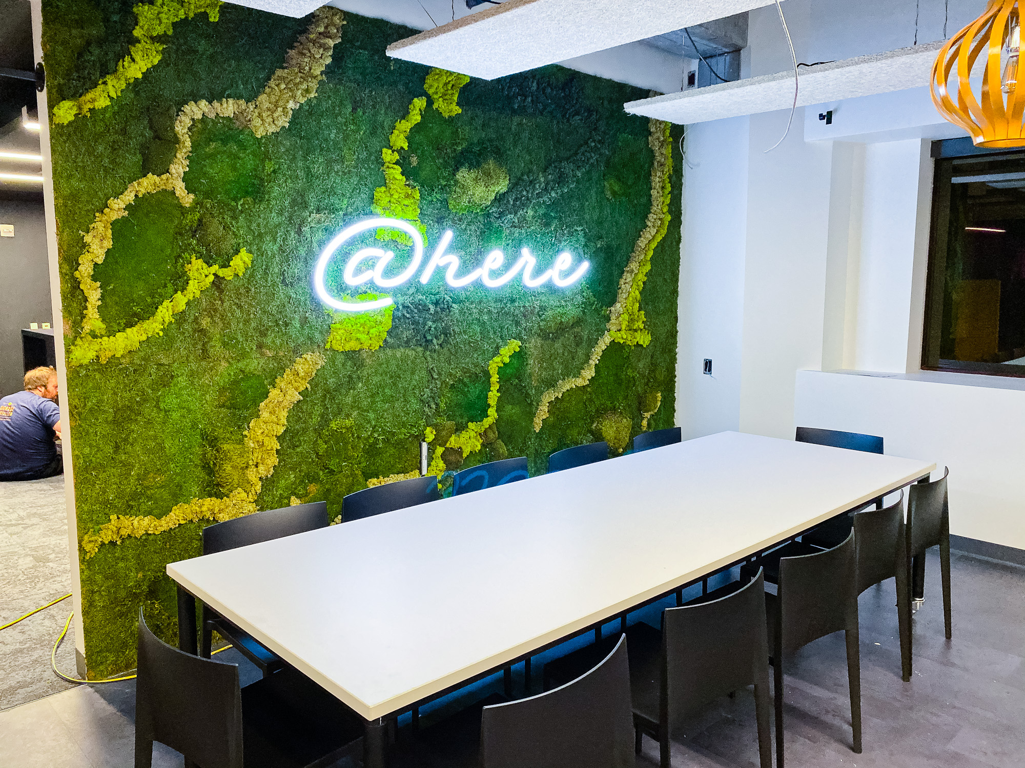 Neon-style @here sign on moss / living wall for the cafeteria/kitchen of Scale, a San Francisco based company delivering high quality training data for AI applications such as self-driving cars, mapping, AR/VR, robotics, and more.